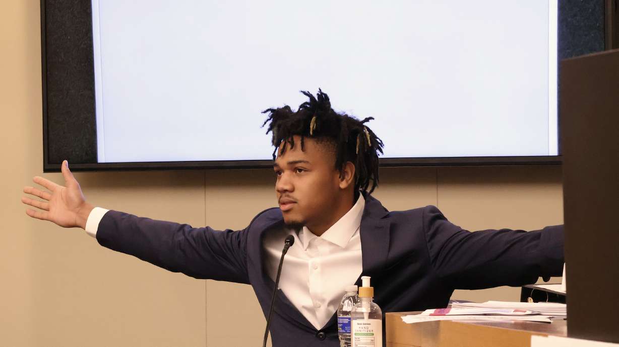 University of Illinois basketball standout Terrence Shannon Jr. demonstrates his wingspan while testifying during his rape trial Thursday June 13, 2024, in Lawrence, Kan. Shannon, of Champaign, Ill., is accused of committing sexual assault on Sept. 9, 2023, in Lawrence, Kan.