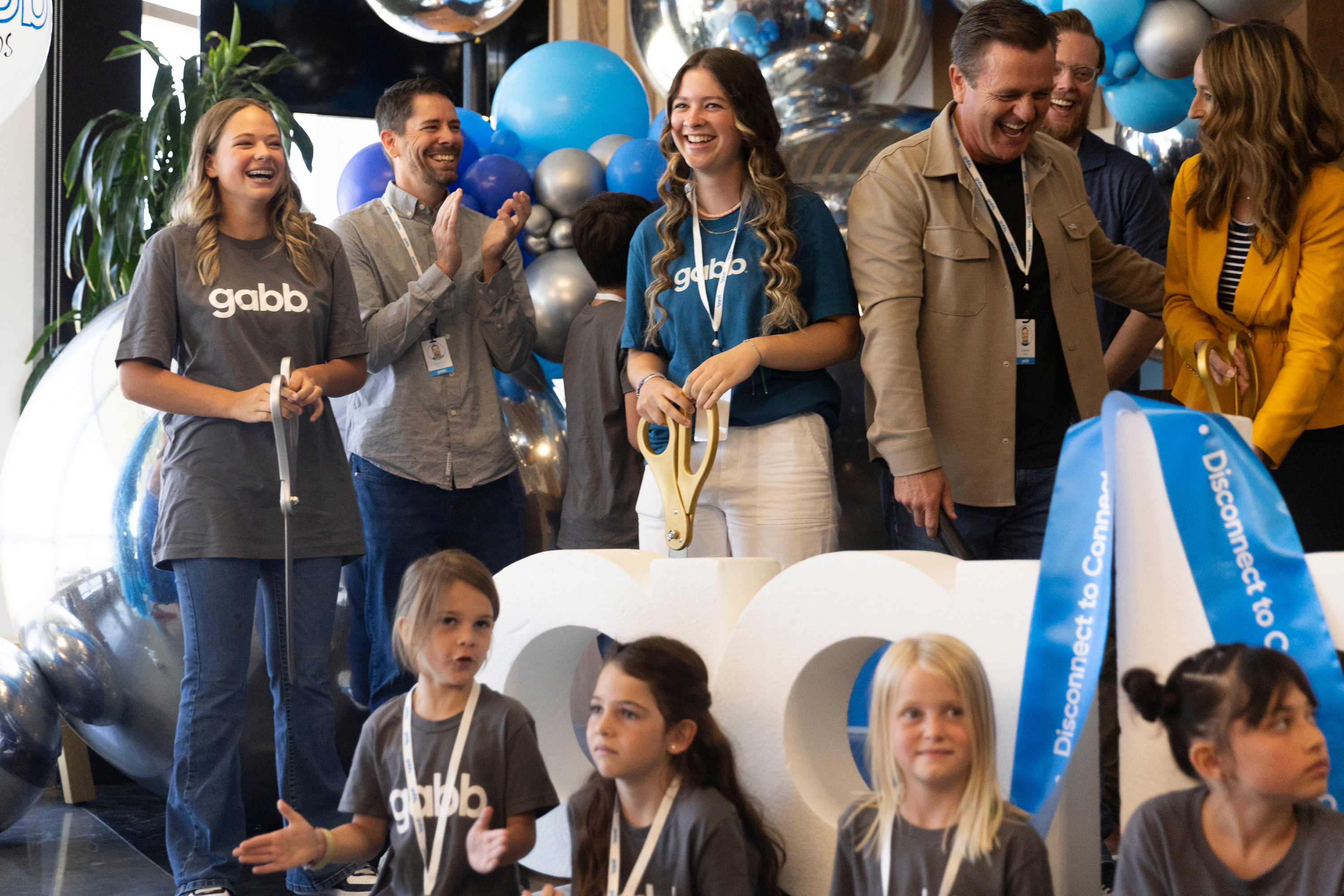 Guests, employees and their families attend a ribbon-cutting ceremony for Gabb Phones at their new headquarters in Lehi on Thursday.