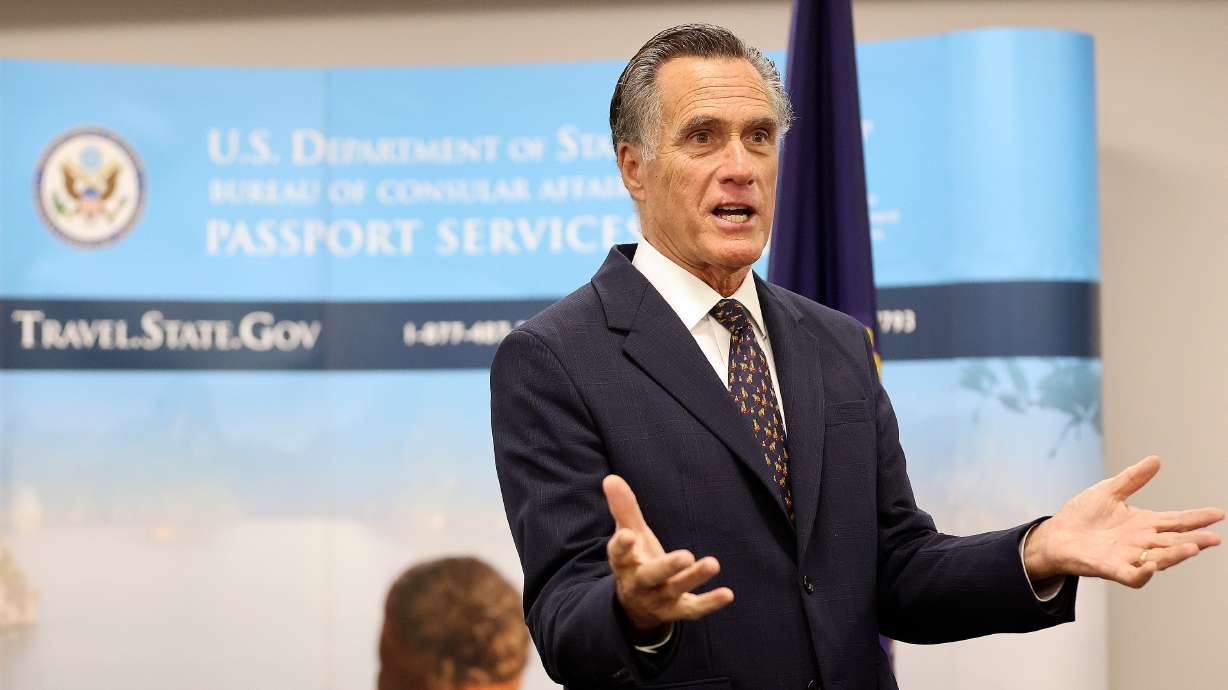 Sen. Mitt Romney speaks at the Bennett Federal Building in Salt Lake City on Feb. 16. Romney is again pursuing legislation mandating the use of the federal E-Verify system to guard against the hiring of unauthorized workers.