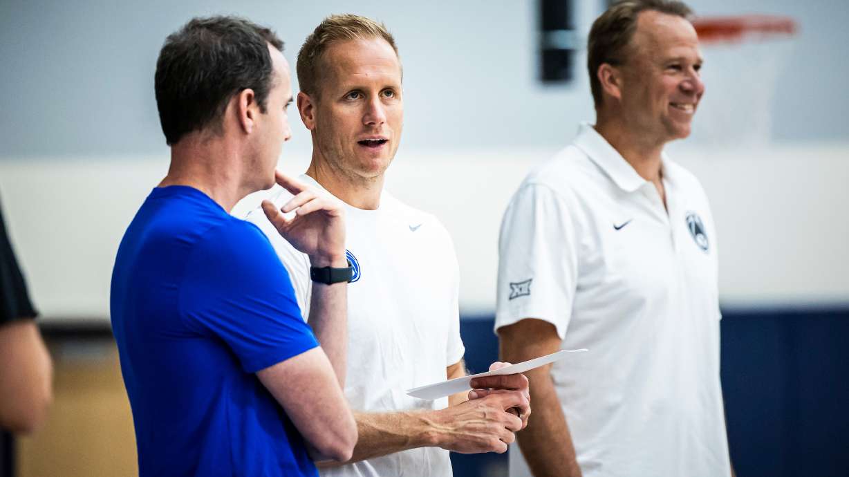 BYU assistant coach Will Voigt, left, speaks with head coach Kevin Young during men's basketball practice at the Marriott Center Annex, June 6, 2024 in Provo, Utah.