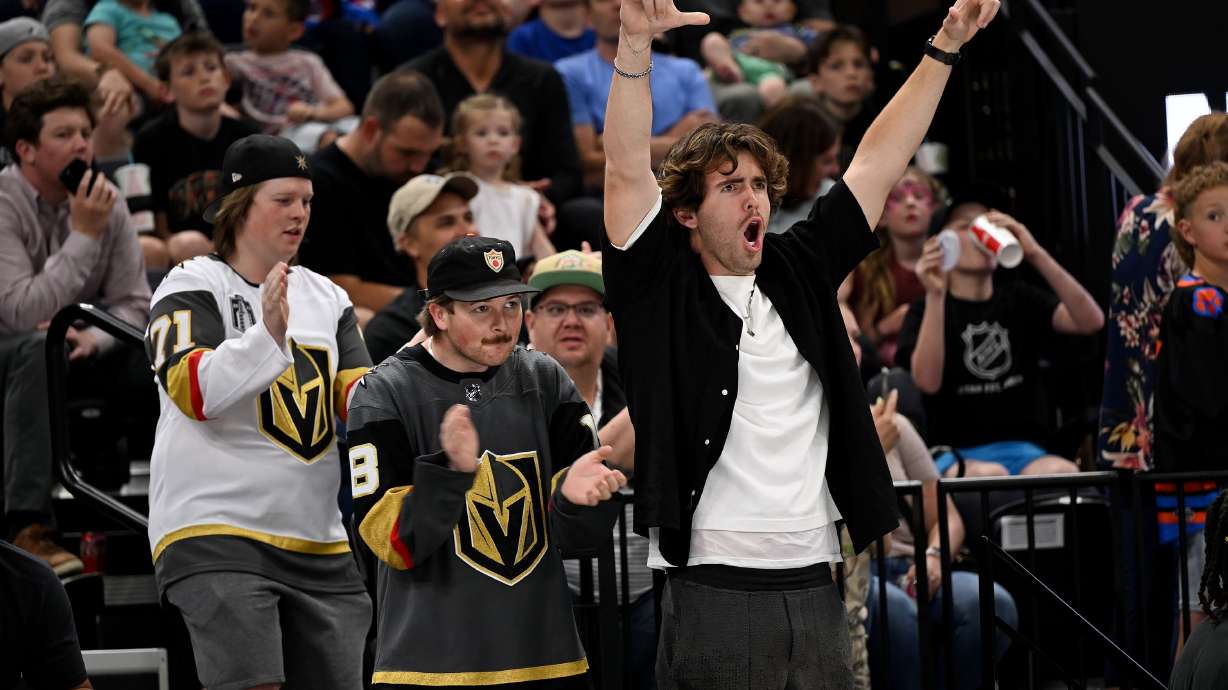 Fans cheer at the Delta Center as Utah’s NHL hockey team is introduced to fans on April 24. Will people go to the games?