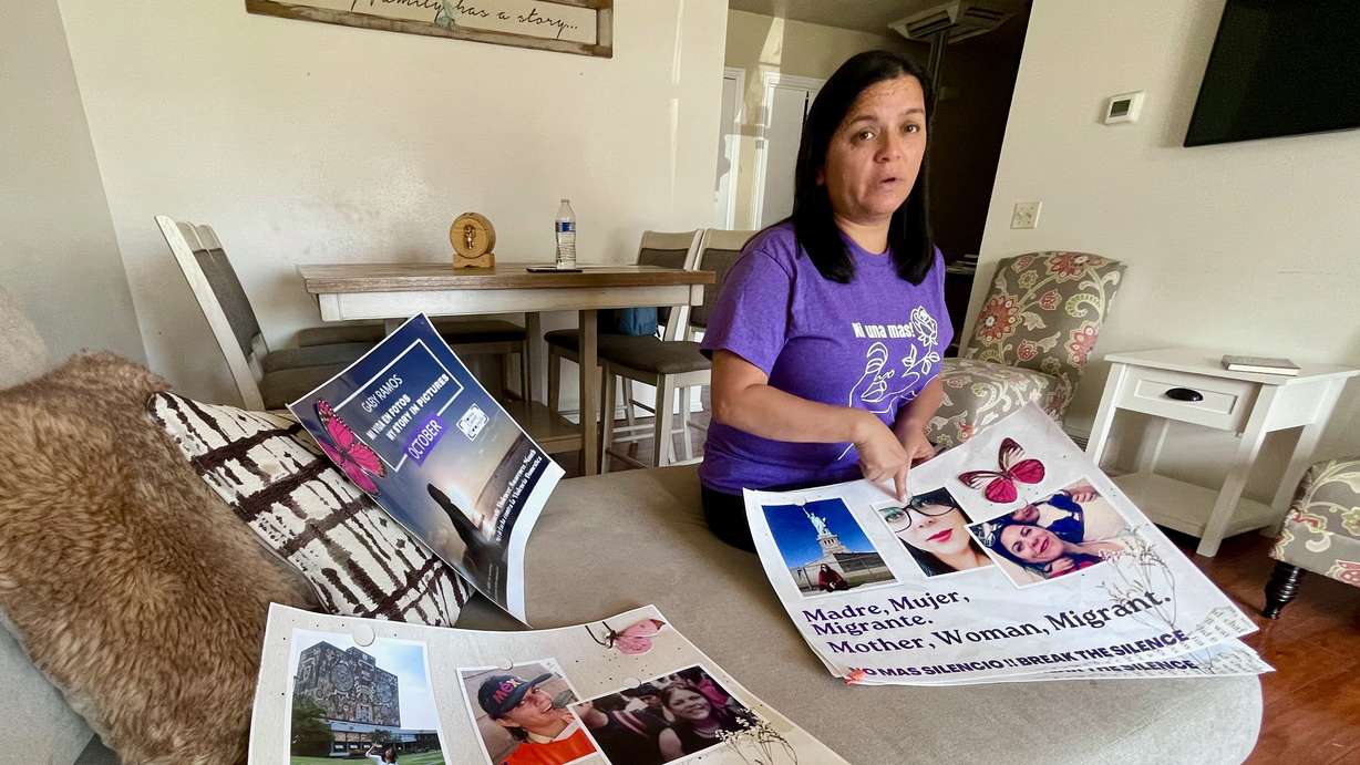 Rocio Cifuentes with posters she made featuring her sister, Gaby Ramos, who prosecutors say was killed at the hands of her ex-boyfriend in 2021, on Wednesday. The photo was taken at Cifuentes' Taylorsville home.