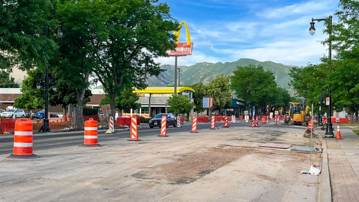 A vehicle travels west on 2100 South past road construction near 900 East in Salt Lake City's Sugar House neighborhood on Thursday. Construction will close all 2100 South eastbound traffic for two blocks beginning on Monday.