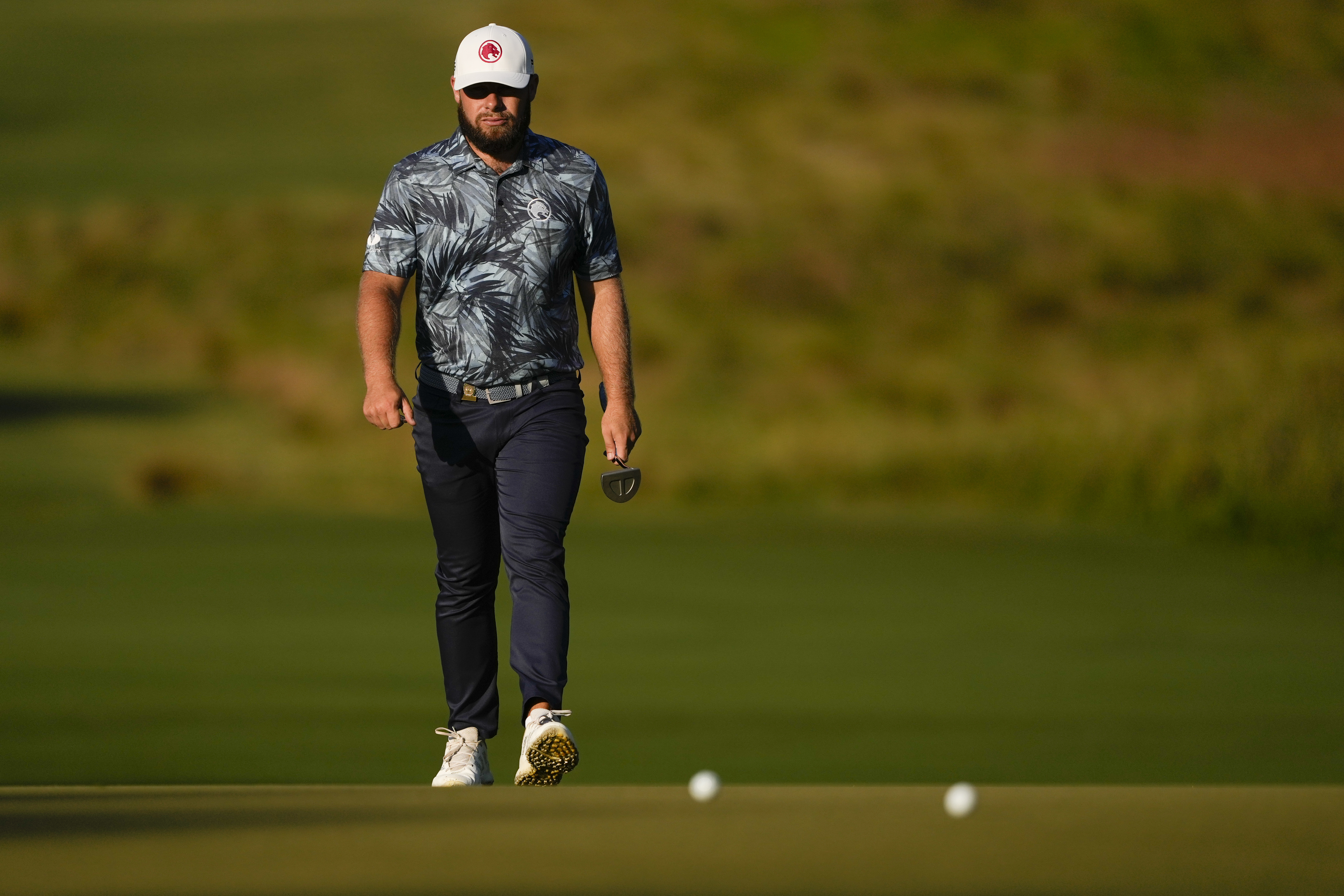 Tyrrell Hatton, of England, walks to the green on the first hole during the second round of the U.S. Open golf tournament Friday, June 14, 2024, in Pinehurst, N.C.
