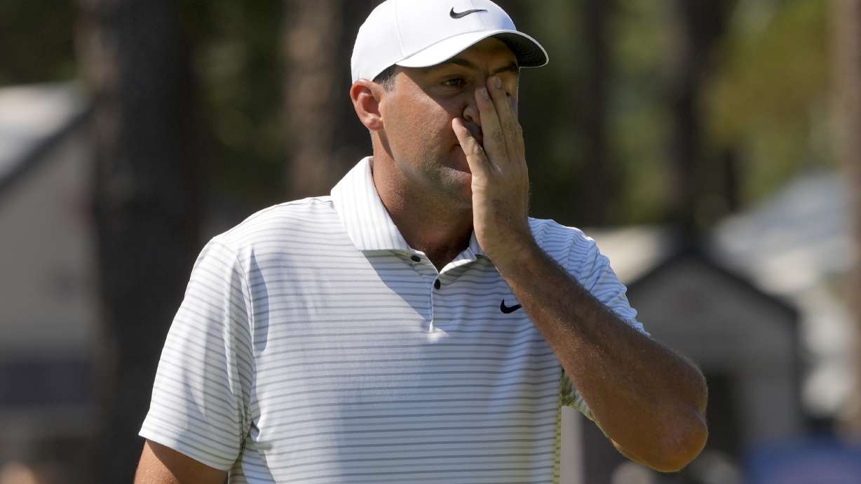 Scottie Scheffler reacts after missing a putt on the second hole during the second round of the U.S. Open golf tournament Friday, June 14, 2024, in Pinehurst, N.C.
