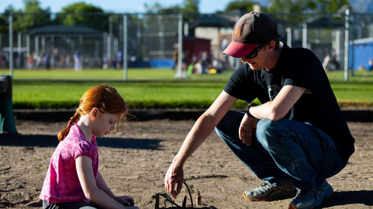 DJ Kimball plays in the sand with his daughter Margaret at Fort Utah Park in Provo on June 4. The heavily Republican state of Utah will likely decide its next U.S. senator on June 25 in the hotly contested primary election to replace Sen. Mitt Romney.