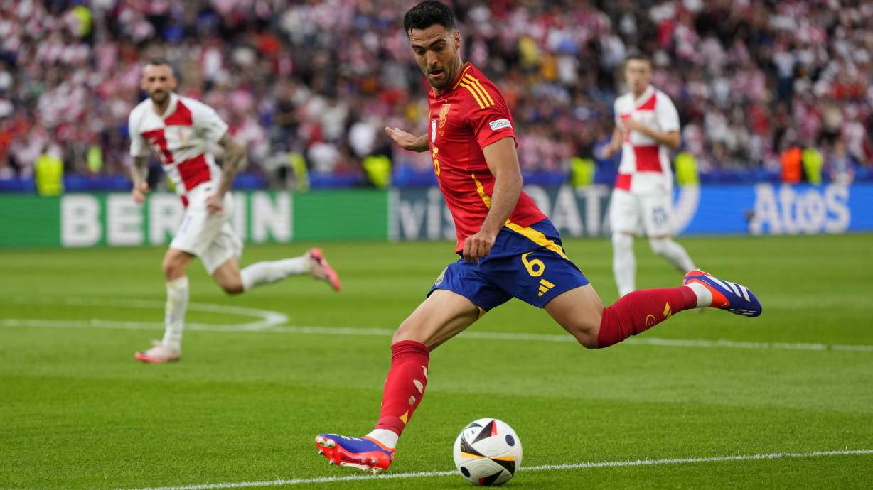 Spain's Mikel Merino shoots the ball during a Group B match between Spain and Croatia at the Euro 2024 soccer tournament in Berlin, Germany, Saturday, June 15, 2024. Spain defeated Croatia 3-0.