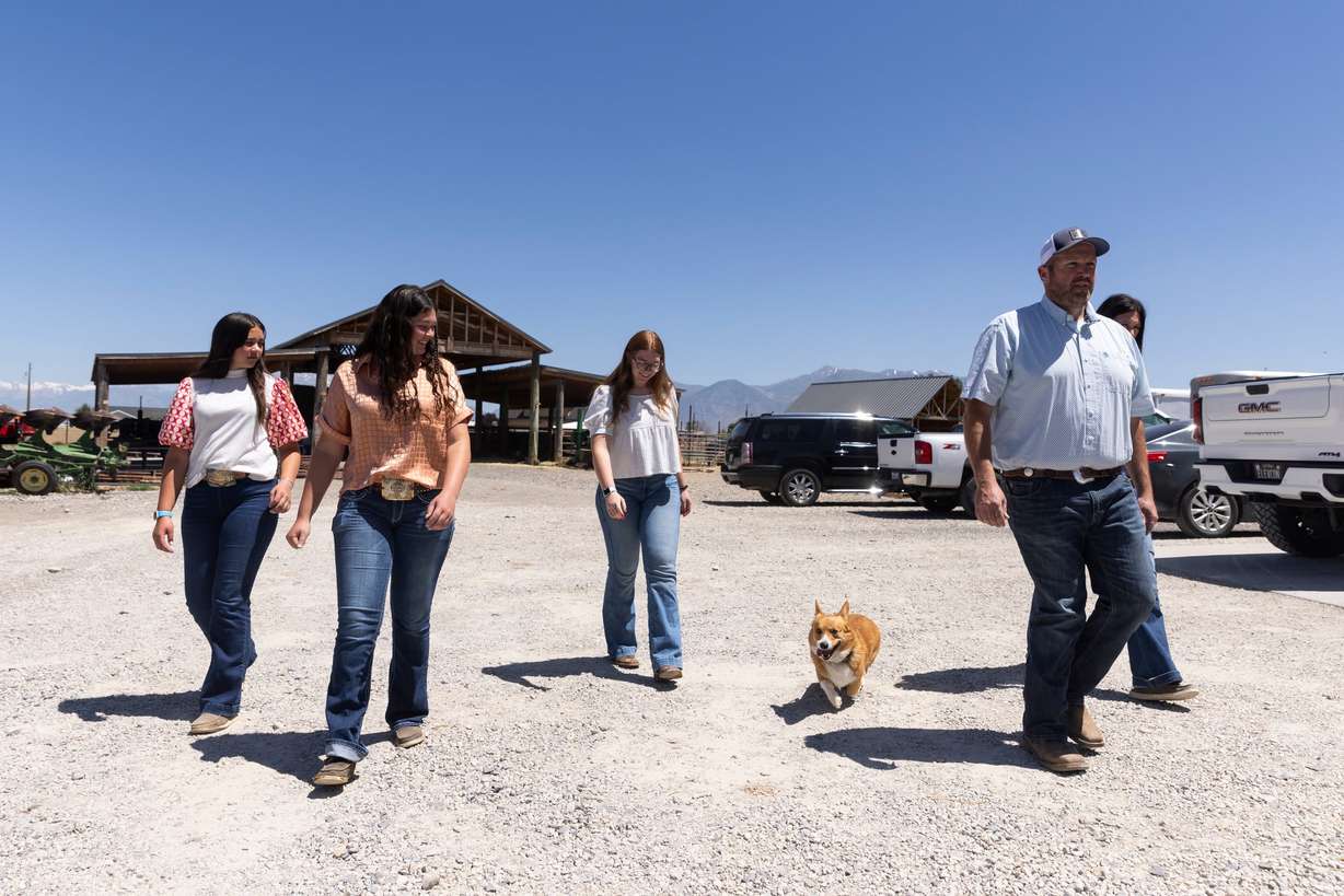 Brody Lambert walks with his wife, Erin, behind him, and their three daughters, Ashlee, Haylee and Brinlee, at their home in Benjamin on Thursday.