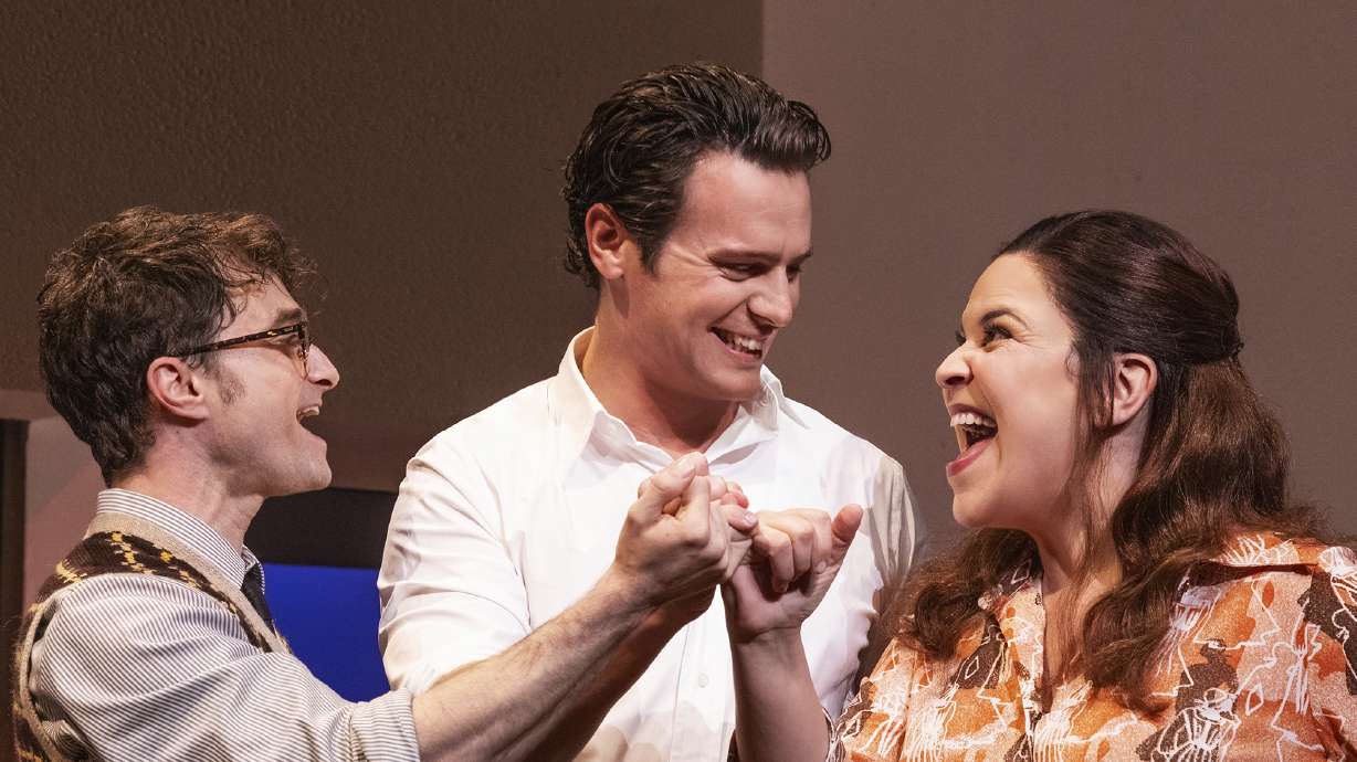 This image released by Polk & Co. shows Daniel Radcliffe, from left, Jonathan Groff and Lindsay Mendez in a scene from "Merrily We Roll Along."