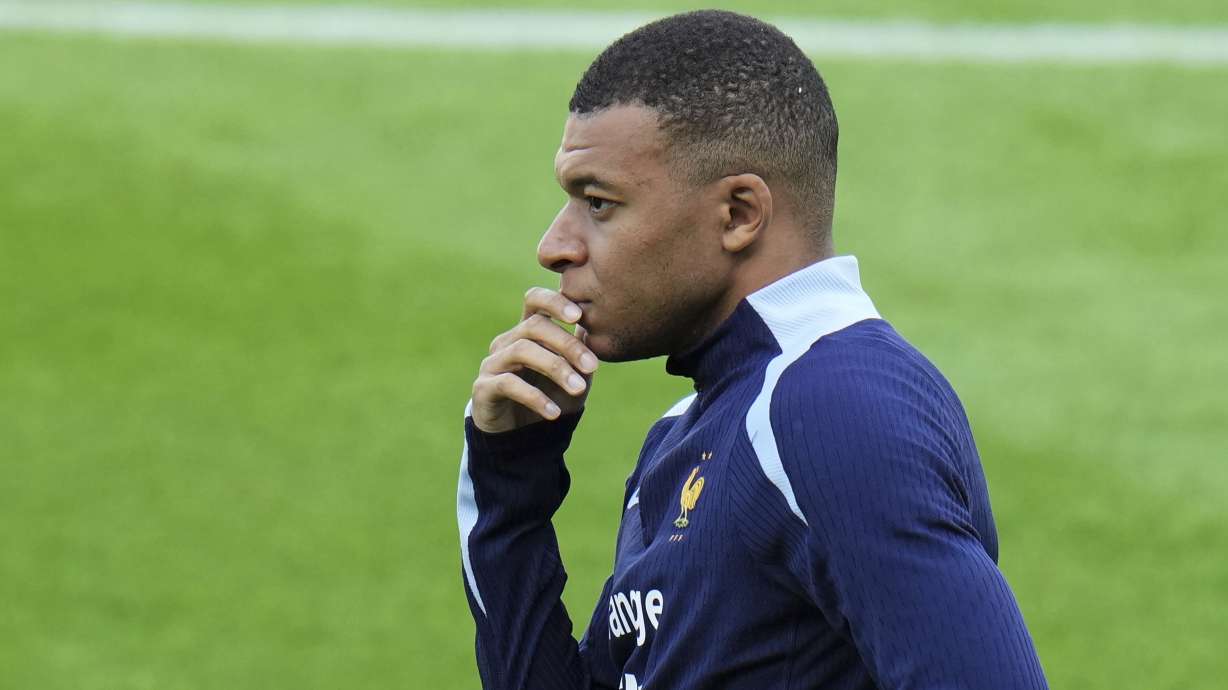France's Kylian Mbappe gestures during a training session in Paderborn, Germany, Thursday, June 13, 2024. Mbappe was absent when the squad took part in an open practice session at its European Championship base on Thursday. France will play against Austria during their Group D soccer match at the Euro 2024 soccer tournament on June 17.