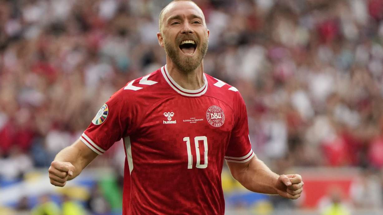 Denmark's Christian Eriksen celebrates after scoring the opening goal of the game during a Group C match between Slovenia and Denmark at the Euro 2024 soccer tournament in Stuttgart, Germany, Sunday, June 16, 2024.