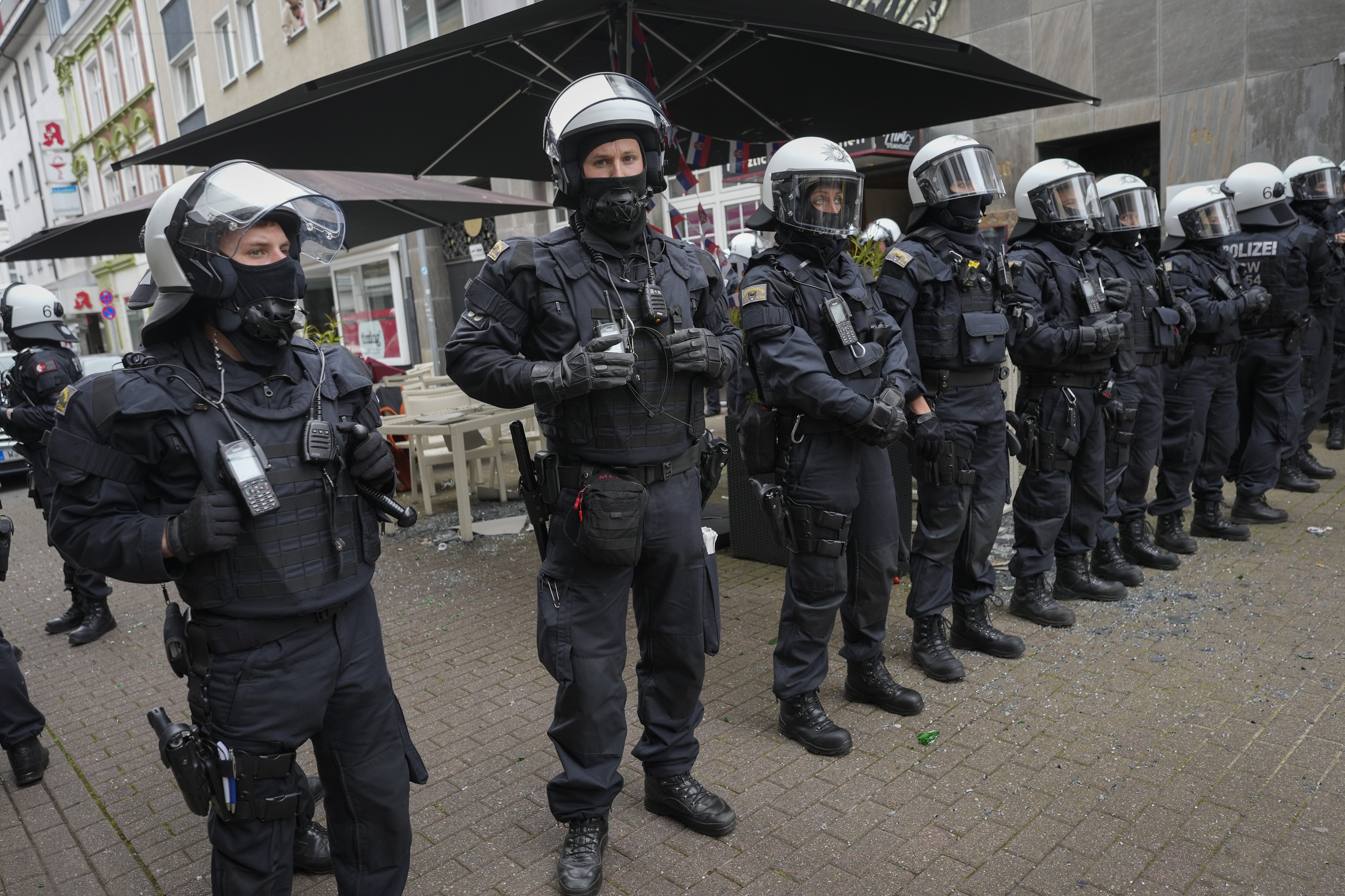 Riot police stand guard on the street ahead the Group C match between Serbia and England at the Euro 2024 soccer tournament in Gelsenkirchen, Germany, Sunday, June 16, 2024.