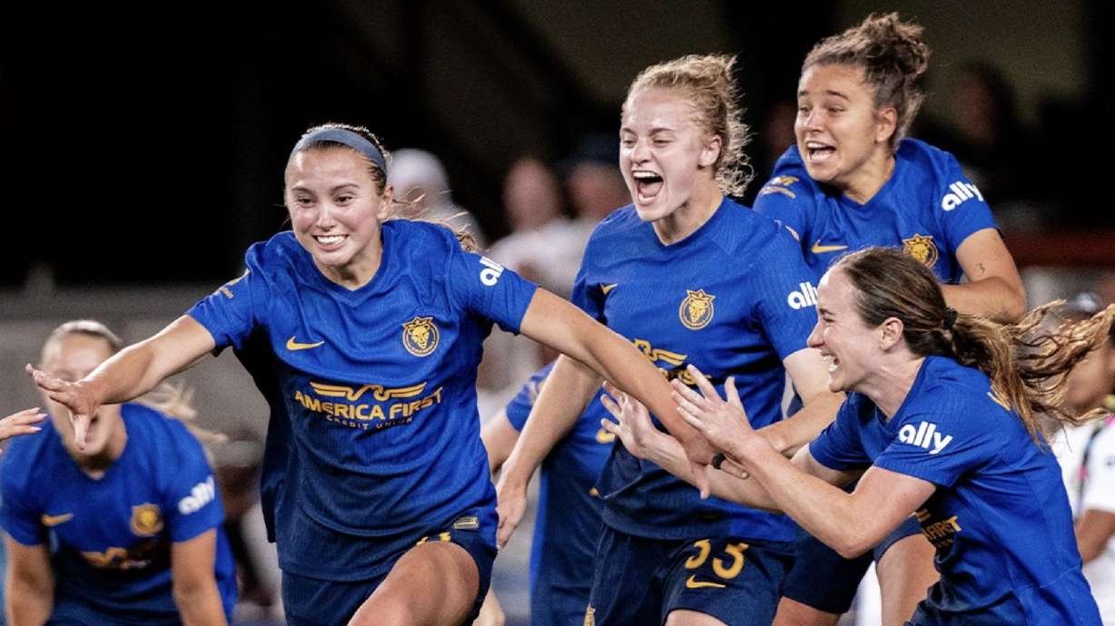 The Utah Royals celebrate the game-winner from Kate Del Fava, left, against Bay FC.