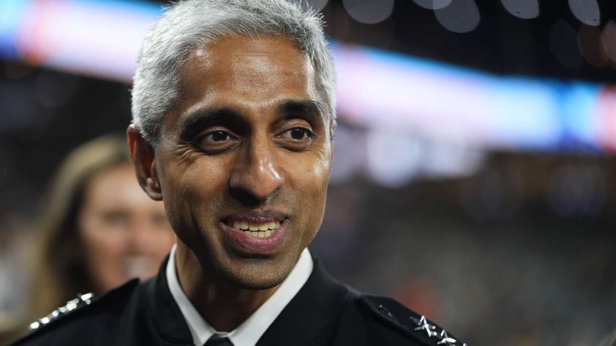 United States Surgeon General Dr. Vivek H. Murthy arrives to throw the first pitch May 29, in Seattle. He is calling on Congress to require social media warning labels, like on cigarette packaging.