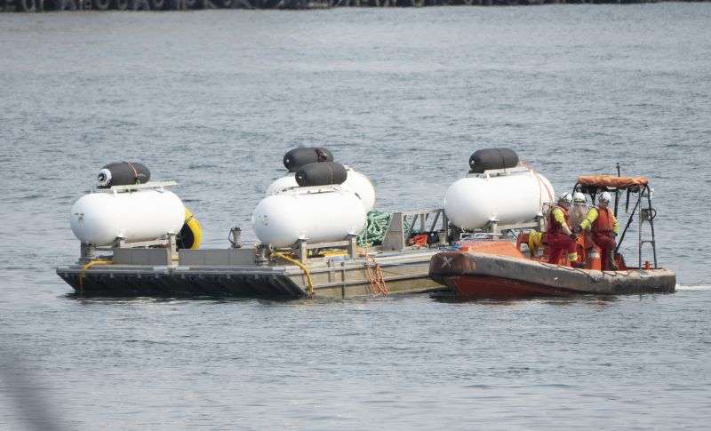 The Titan launch barge is moved to the Coast Guard yard at port in St. John's, Canada in this June 24, 2023 photo. The deadly implosion of an experimental submersible en route to the deep-sea grave of the Titanic last June has not dulled the desire for deep-sea exploration.
