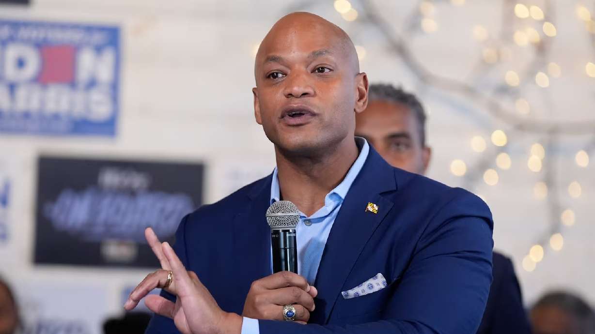 Maryland Gov. Wes Moore speaks with President Joe Biden on May 29 in Philadelphia. Moore pardoned thousands of people convicted of low-level marijuana crimes Monday.