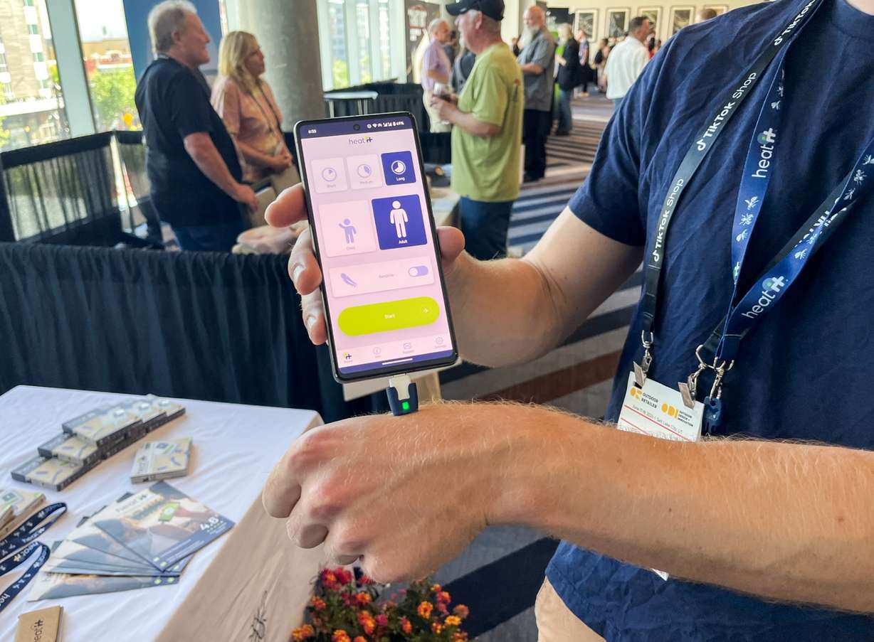 Heat It inventor Lukas Liedtke demonstrates his product during an Outdoor Retailer event in Salt Lake City on Sunday.