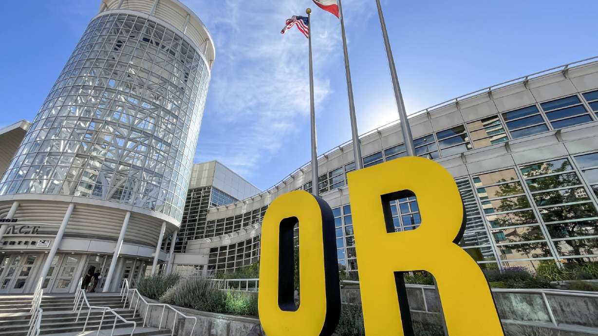 An Outdoor Retailer sign is pictured outside of the Salt Palace Convention Center in Salt Lake City on Sunday. The event will continue in Utah through Wednesday.