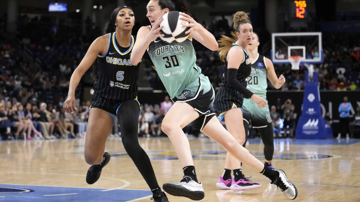 New York Liberty's Breanna Stewart (30) drives to the basket as Chicago Sky's Angel Reese (5) defends during the second half of a WNBA basketball game Tuesday, June 4, 2024, in Chicago. The Liberty won 88-75.