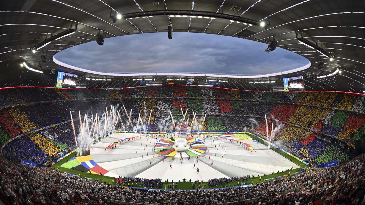 FILE - Dancers perform during the opening ceremony ahead of the Group A match between Germany and Scotland at the Euro 2024 soccer tournament in Munich, Germany, Friday, June 14, 2024. A German YouTuber says he made it onto the field during the European Championship opening ceremony while disguised in a mascot costume. Marvin Wildhage has published a video appearing to show how he entered the stadium in a fake costume and danced on the corner of the field during the ceremony before being led away by a UEFA staff member.