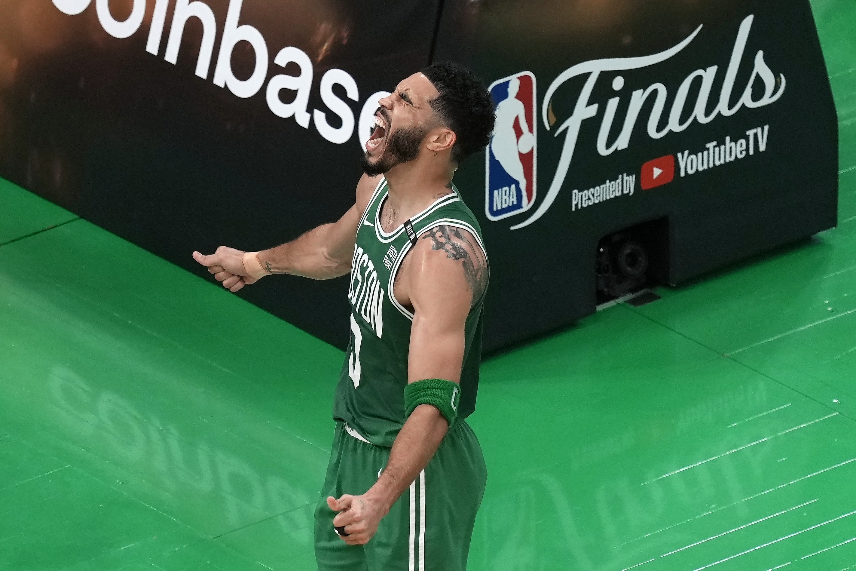 Boston Celtics' Jayson Tatum celebrates after scoring during the first half of Game 5 of the NBA basketball finals against the Dallas Mavericks, Monday, June 17, 2024, in Boston.