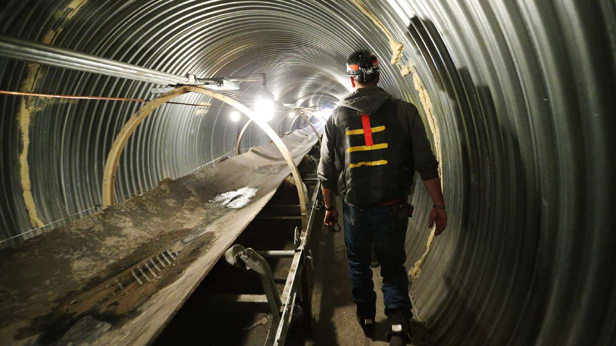 Adrian Childs walks by the reclaimed coal tunnel conveyor belt at the Bronco Utah Mine near Emery on March 29, 2017. Rep. Celeste Maloy, R-Utah, introduced on Tuesday the Full Responsibility and Expedited Enforcement Act.
