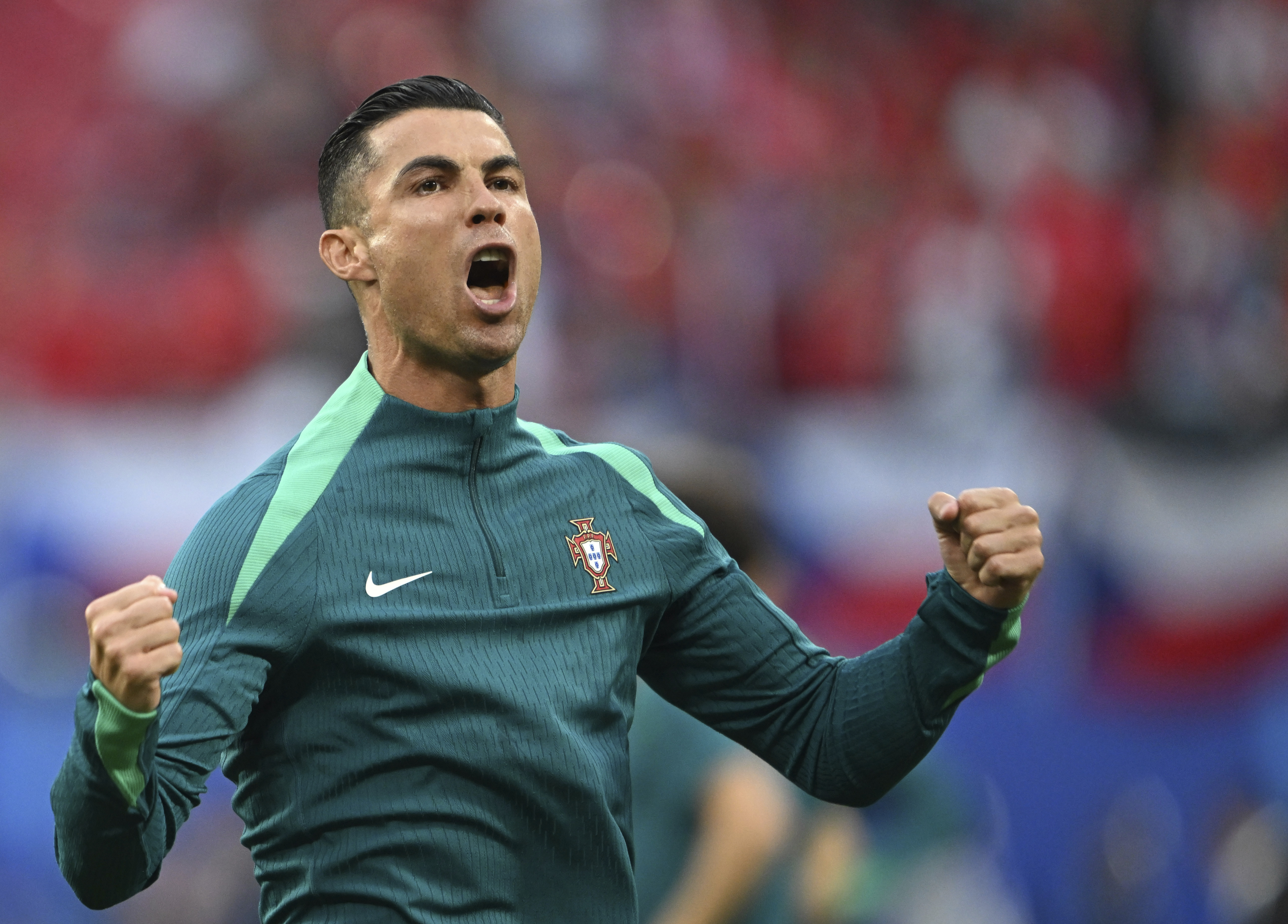 Portugal's Cristiano Ronaldo shouts during the warm up prior for a Group F match between Portugal and Czech Republic at the Euro 2024 soccer tournament in Leipzig, Germany, Tuesday, June 18, 2024. 