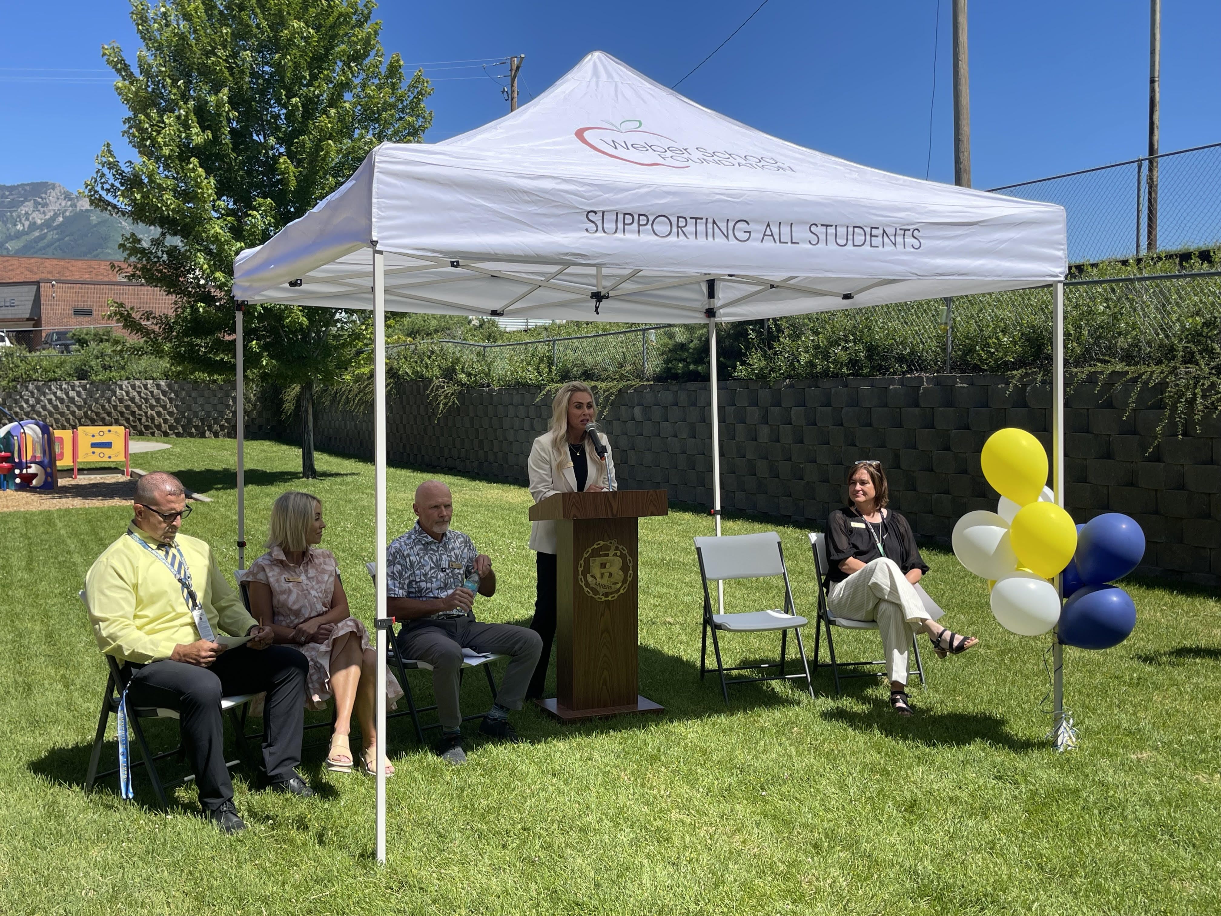Emily Oyler, executive director of the Weber School Foundation, speaks at the opening of the Bonneville Teen Center at Bonneville High School in Washington Terrace, Weber County, on Tuesday.