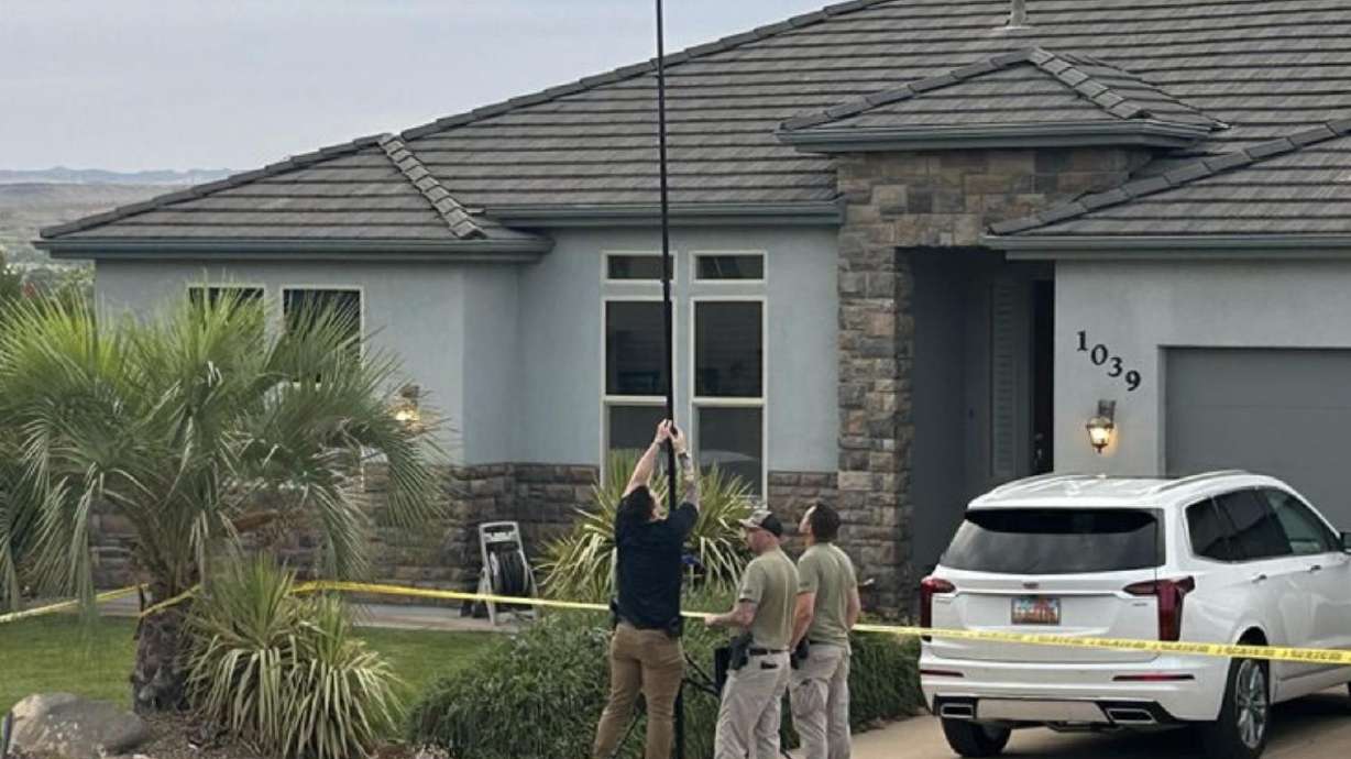 The Washington Police Department investigates the scene of a fatal shooting in Washington, Tuesday.