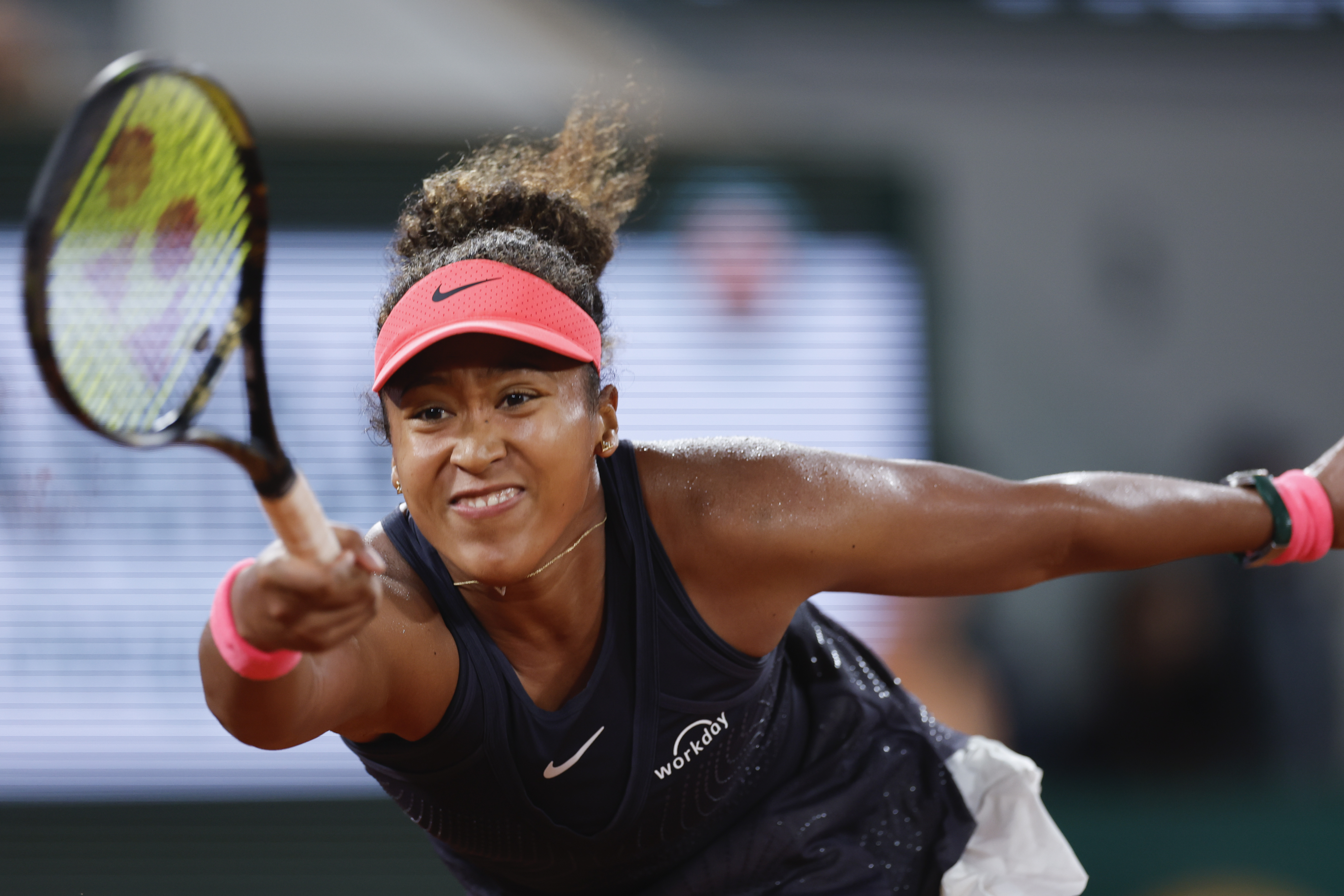 Japan's Naomi Osaka plays a shot against Poland's Iga Swiatek during their second round match of the French Open tennis tournament at the Roland Garros stadium in Paris, Wednesday, May 29, 2024. 