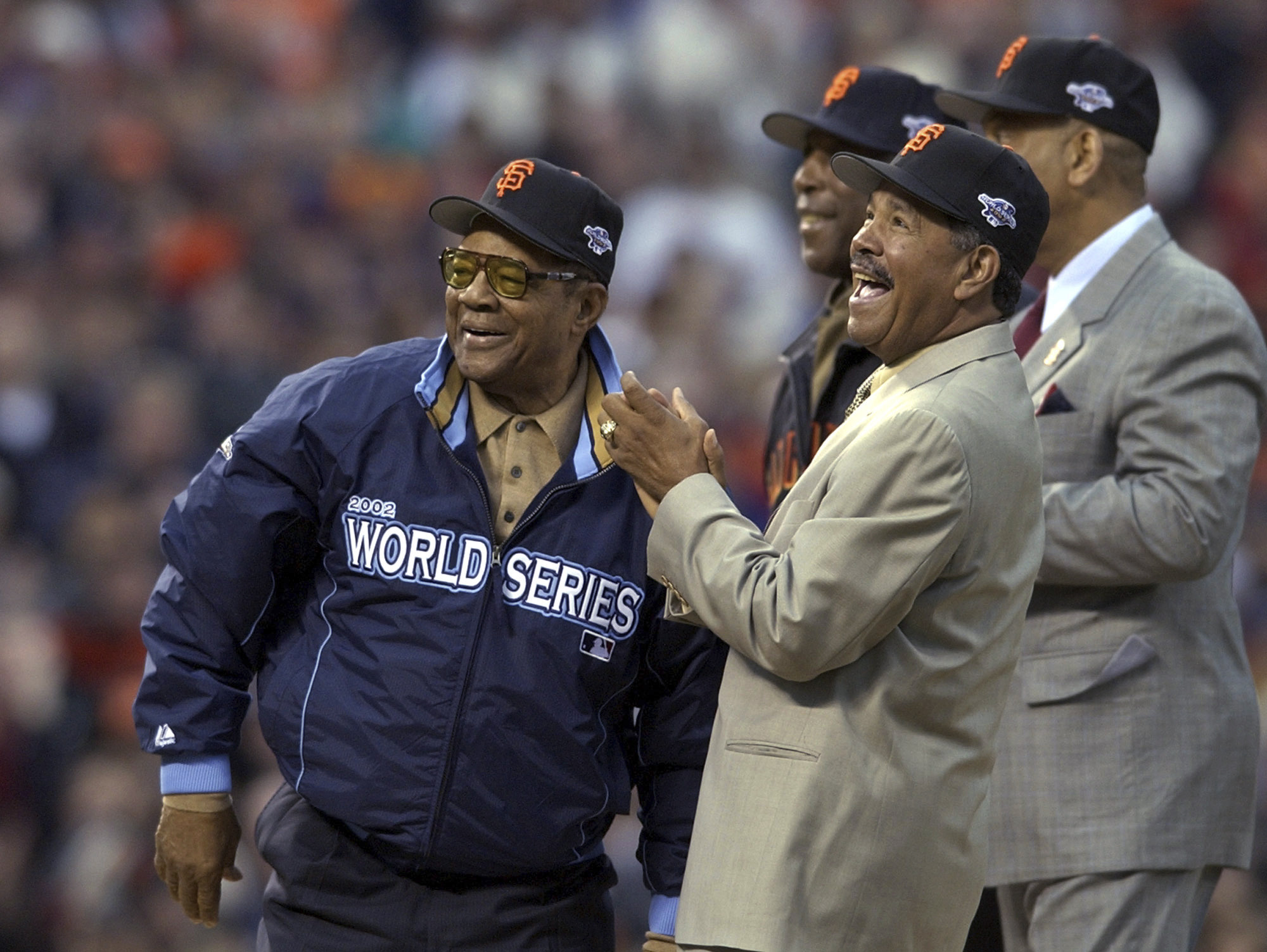 FILE - Willie Mays, left, is joined by former San Francisco Giants' Orlando Cepeda, right, Willie McCovey and Juan Marichal, front, before Game 3 of the World Series between the Giants and the Anaheim Angels in San Francisco,Oct. 22, 2002. Mays, the electrifying “Say Hey Kid” whose singular combination of talent, drive and exuberance made him one of baseball’s greatest and most beloved players, has died. He was 93. Mays' family and the San Francisco Giants jointly announced Tuesday night, June 18, 2024, he had “passed away peacefully” Tuesday afternoon surrounded by loved ones. 