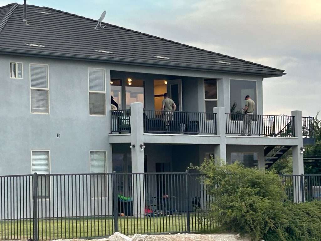 The Washington Police Department investigates the scene of a double homicide in Washington, Tuesday.