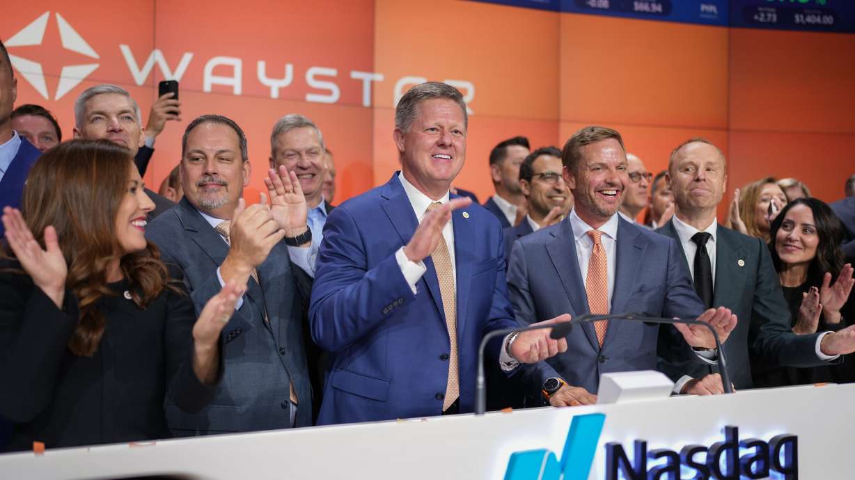 Waystar CEO Matthew Hawkins, center, gathers with employees on June 6 at the NASDAQ exchange in New York City. The company was there to mark its initial public stock offering, which raised nearly $1 billion for the health care payment software innovator based in Lehi.