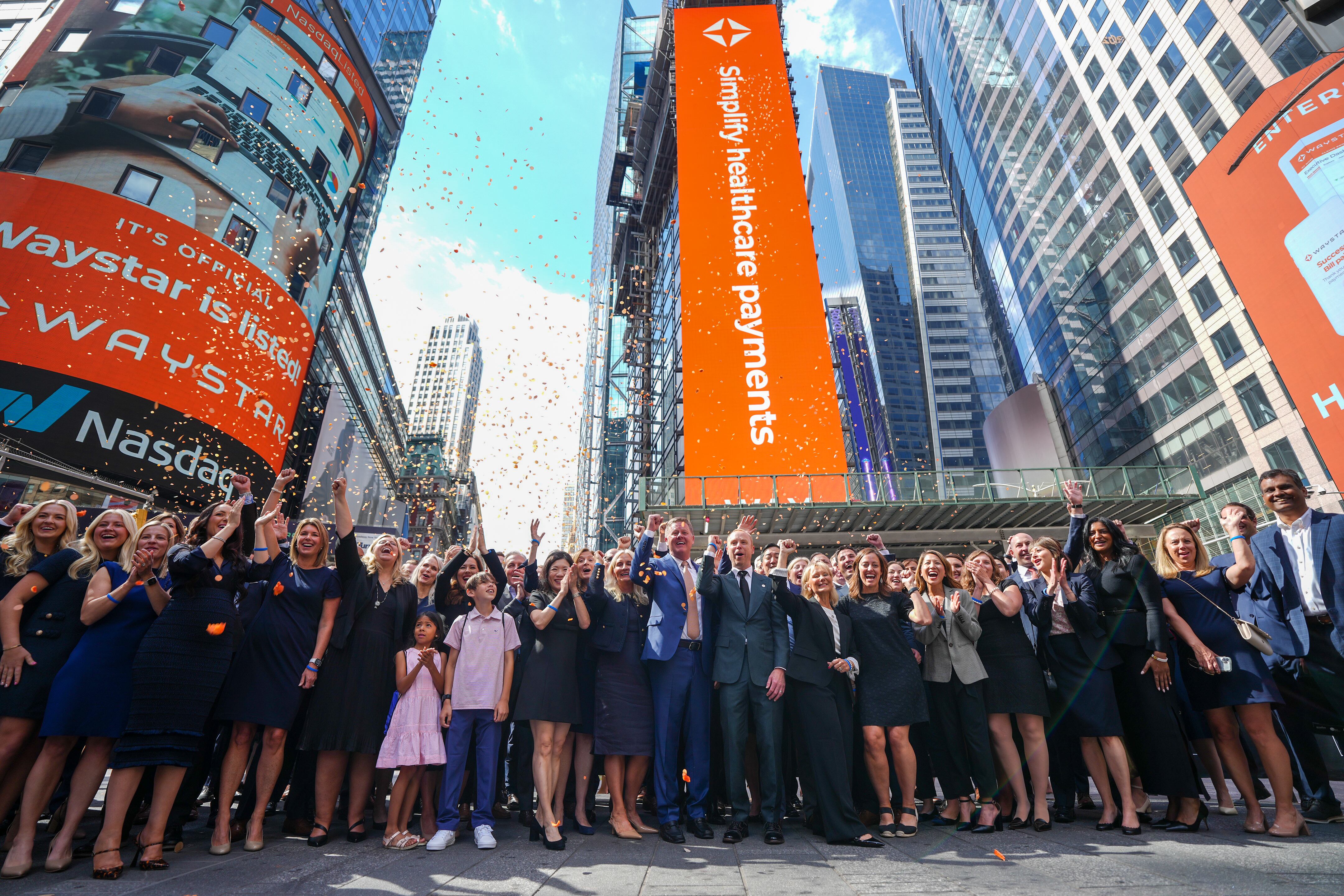 Waystar CEO Matthew Hawkins, center, gathers with employees on June 6 at the NASDAQ exchange in New York City.