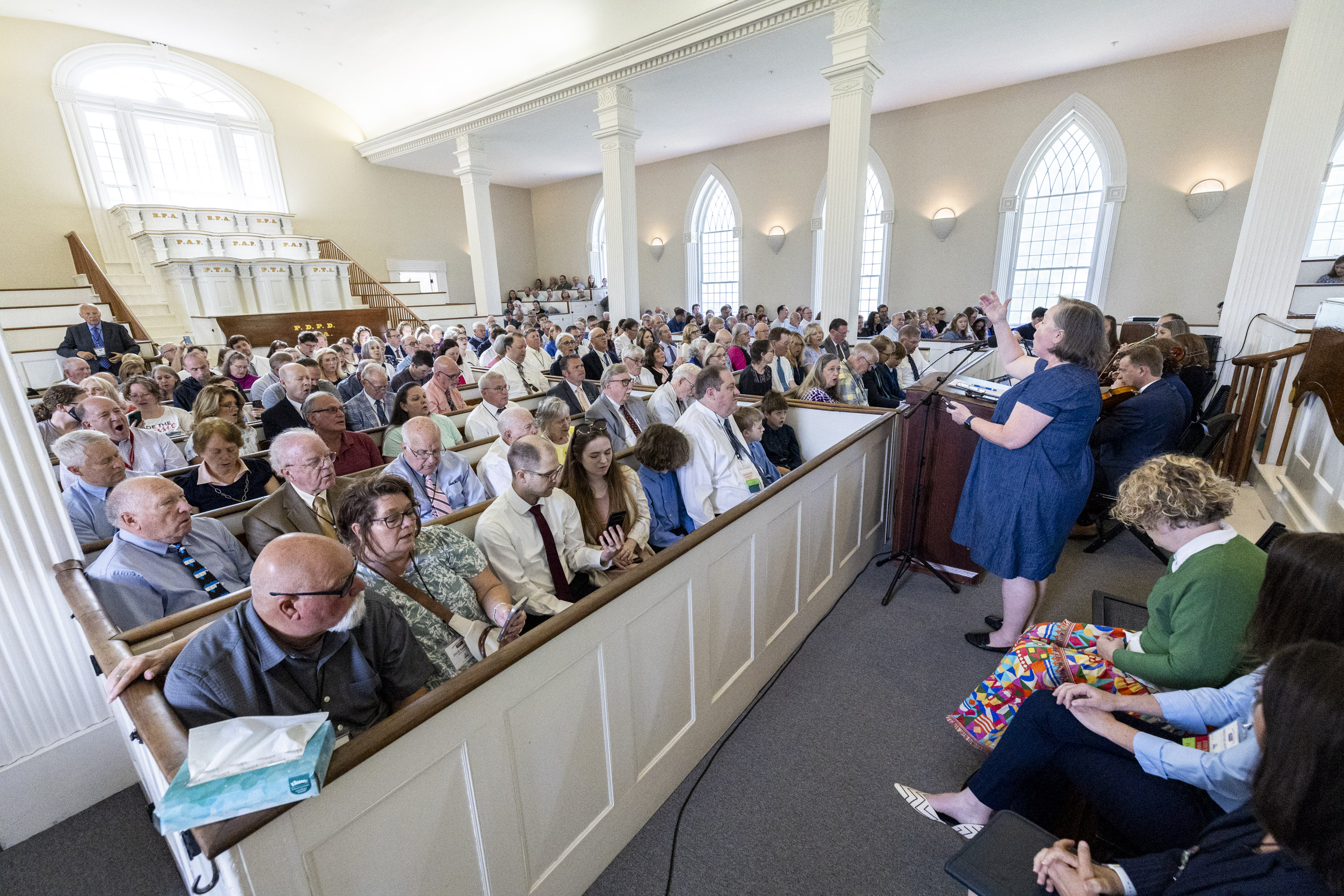 Attendees sing as a devotional is held at the Kirtland Temple in Kirtland, Ohio, on Sunday, June 16, 2024.