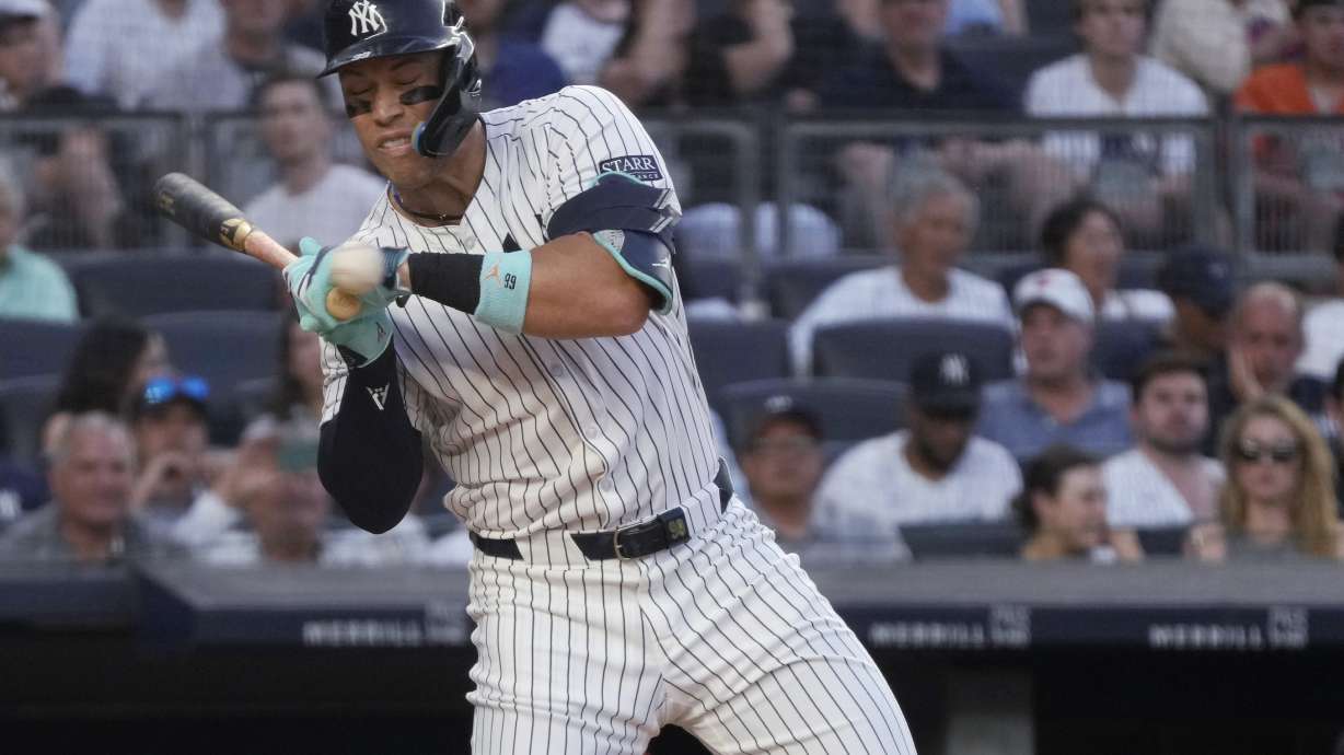 New York Yankees' Aaron Judge reacts to getting hit by a pitch from Baltimore Orioles' Albert Suárez during the third inning of a baseball game Tuesday, June 18, 2024, in New York.