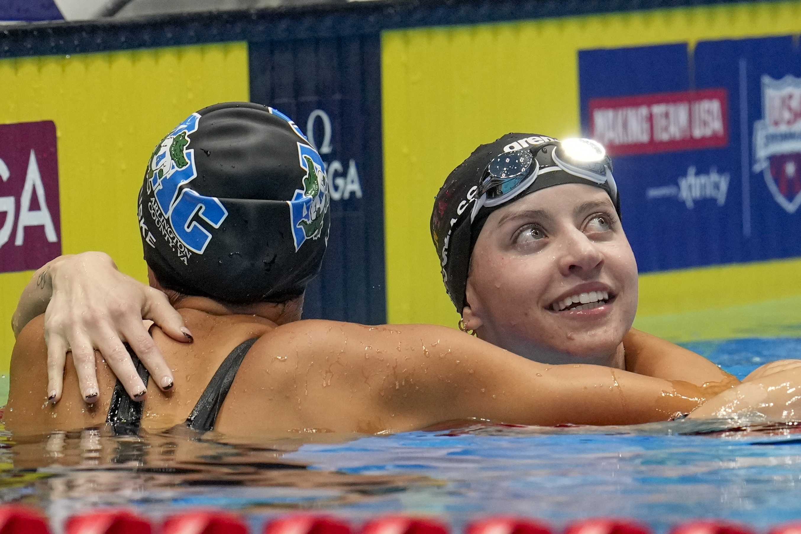 Kate Douglass and Torri Huske embrace after the Women's 100 freestyle finals Wednesday, June 19, 2024, at the US Swimming Olympic Trials in Indianapolis. 