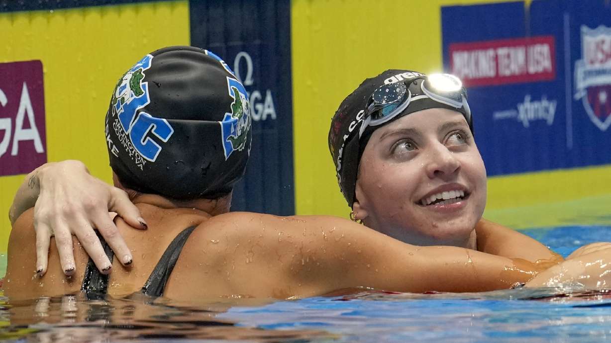 Kate Douglass and Torri Huske embrace after the Women's 100 freestyle finals Wednesday, June 19, 2024, at the US Swimming Olympic Trials in Indianapolis.