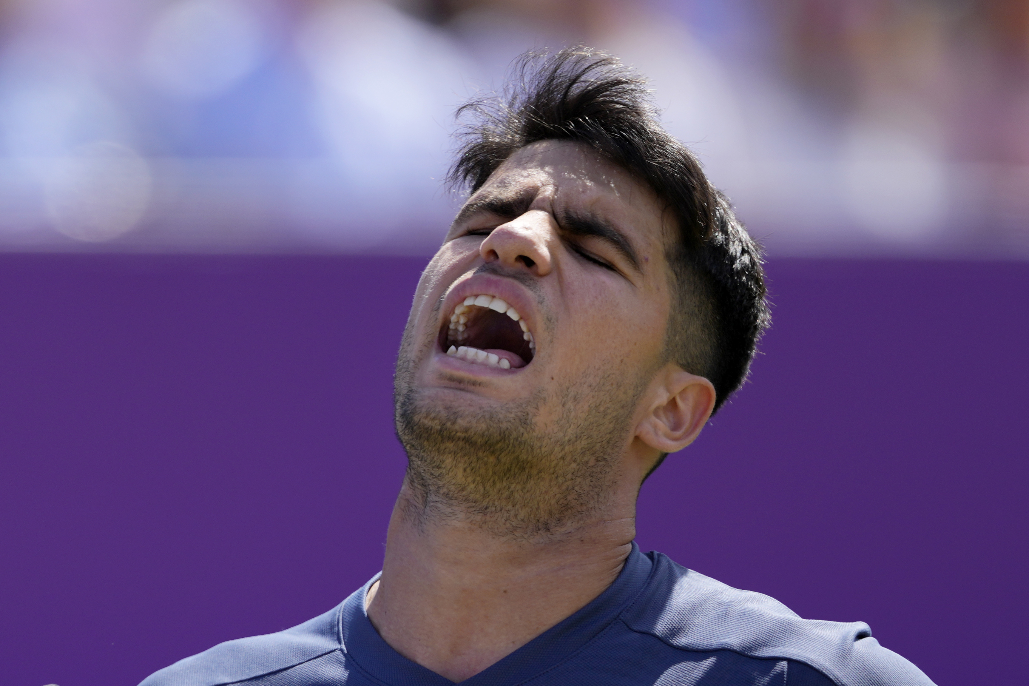 Carlos Alcaraz of Spain reacts after losing a point against Jack Draper of Britain during their men's singles match on day six of The Queen's Club tennis tournament, in London, Thursday, June 20, 2024. 