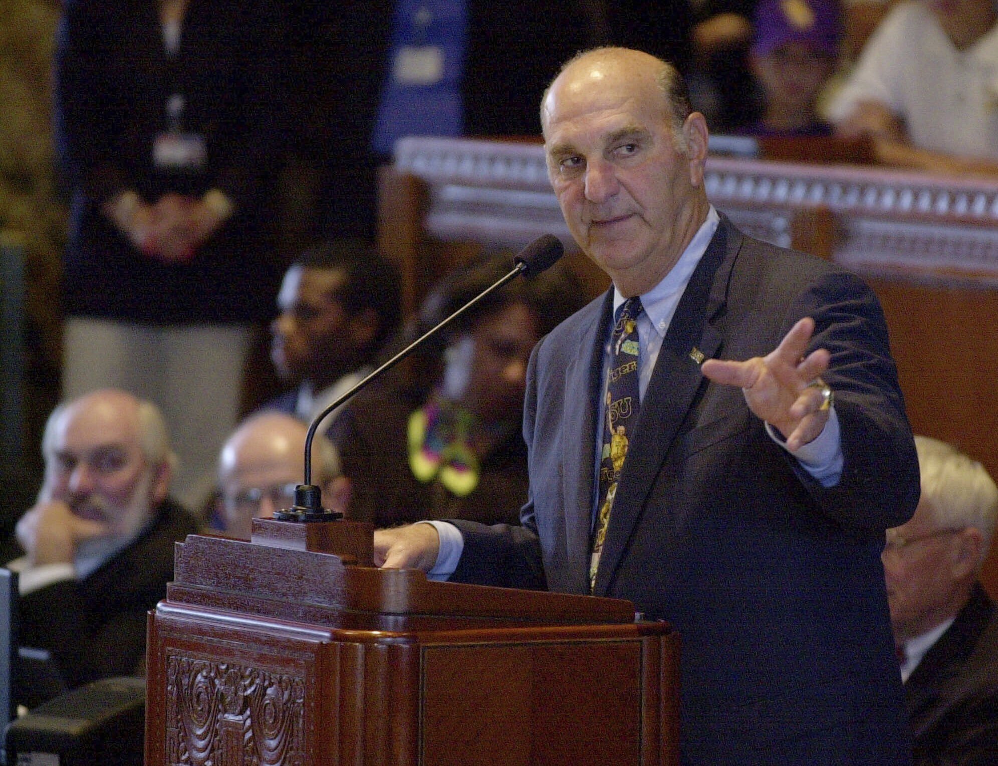 FILE - Louisiana State baseball coach Skip Bertman addresses the state House of Representatives at the Capitol in Baton Rogue, La., June 21, 2000. Bertman's 1997 Tigers slugged 188 home runs in 70 games on their way to the second of two straight national championships and were the inspiration for the phrase "gorilla ball,” the descriptor for the style of offense in an era when bats were juiced and balls flew out of ballparks at unprecedented rates. 
