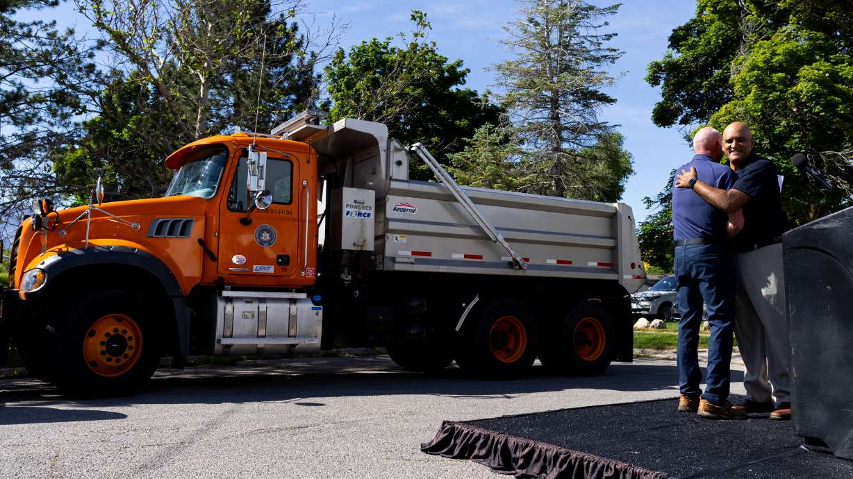 From left, Carlos Braceras, executive director of Utah Department of Transportation, greets Shailen Bhatt, federal highway administrator, at a press conference about UDOT’s “Connect the West” initiative thanks to a major federal grant near Foothill Drive in Salt Lake City on Thursday.