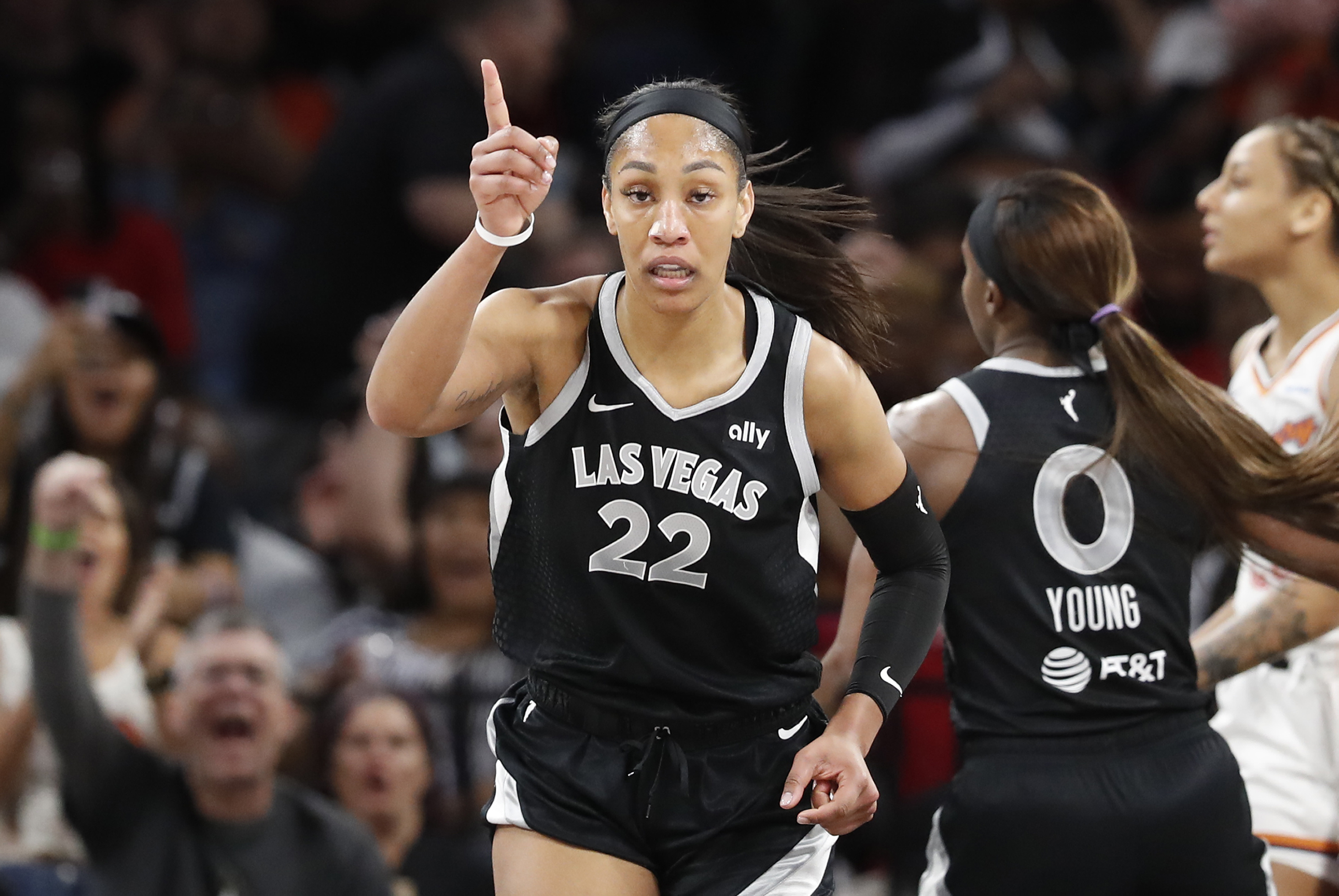 Las Vegas Aces center A'ja Wilson (22) celebrates after making a basket against the Phoenix Mercury during the first half of a WNBA basketball game Tuesday, May 21, 2024, in Las Vegas.