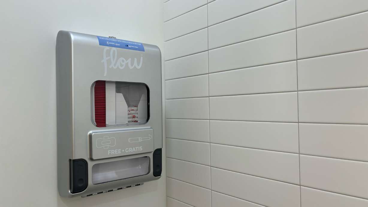 A new dispenser in the Salt Lake County Library Granite Branch offers patrons free period products. All of the library's branches will have the products, thanks to a grant.