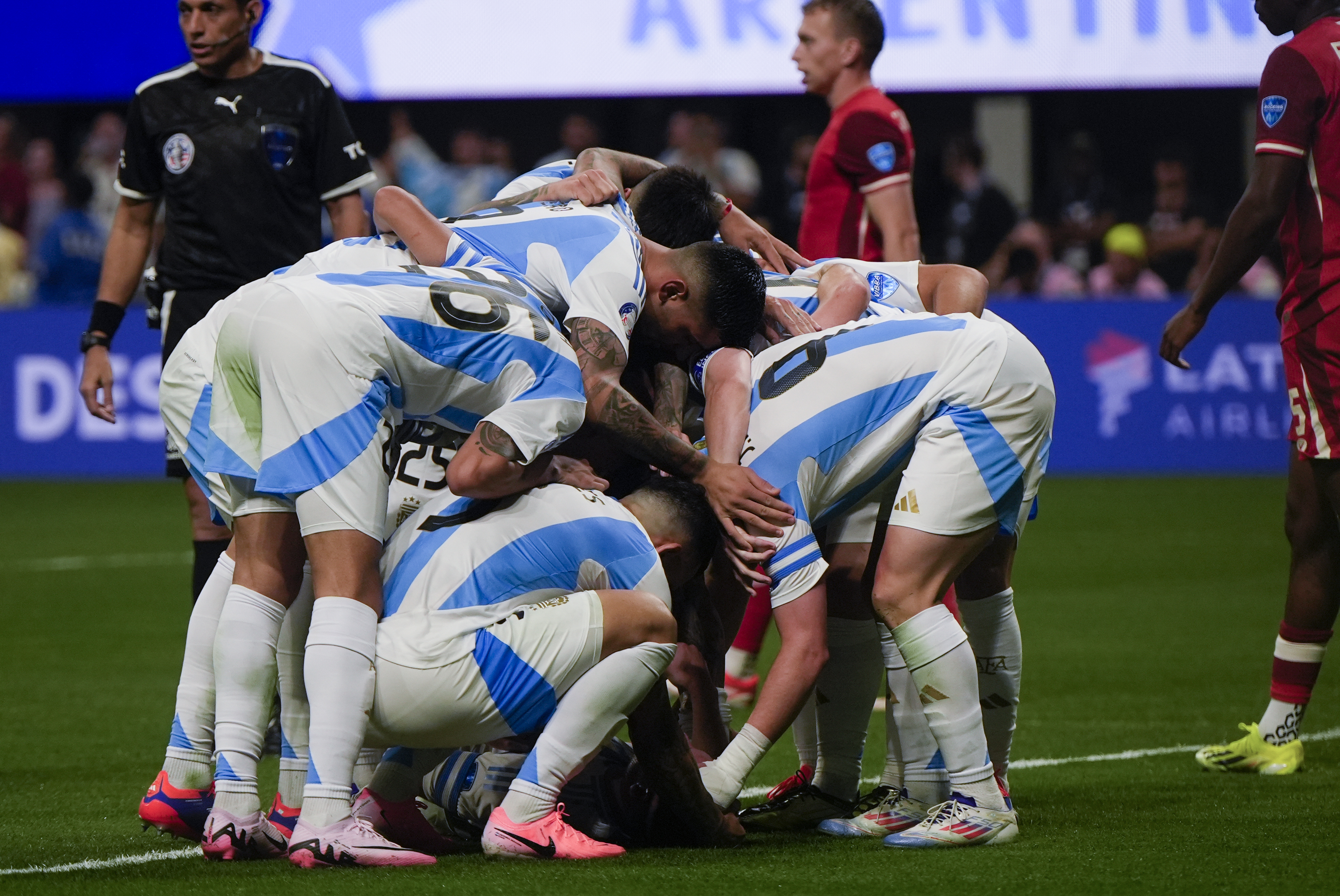 Argentina's players celebrate Julian Alvarez's opening goal against Canada during a Copa America Group A soccer match in Atlanta, Thursday, June 20, 2024.