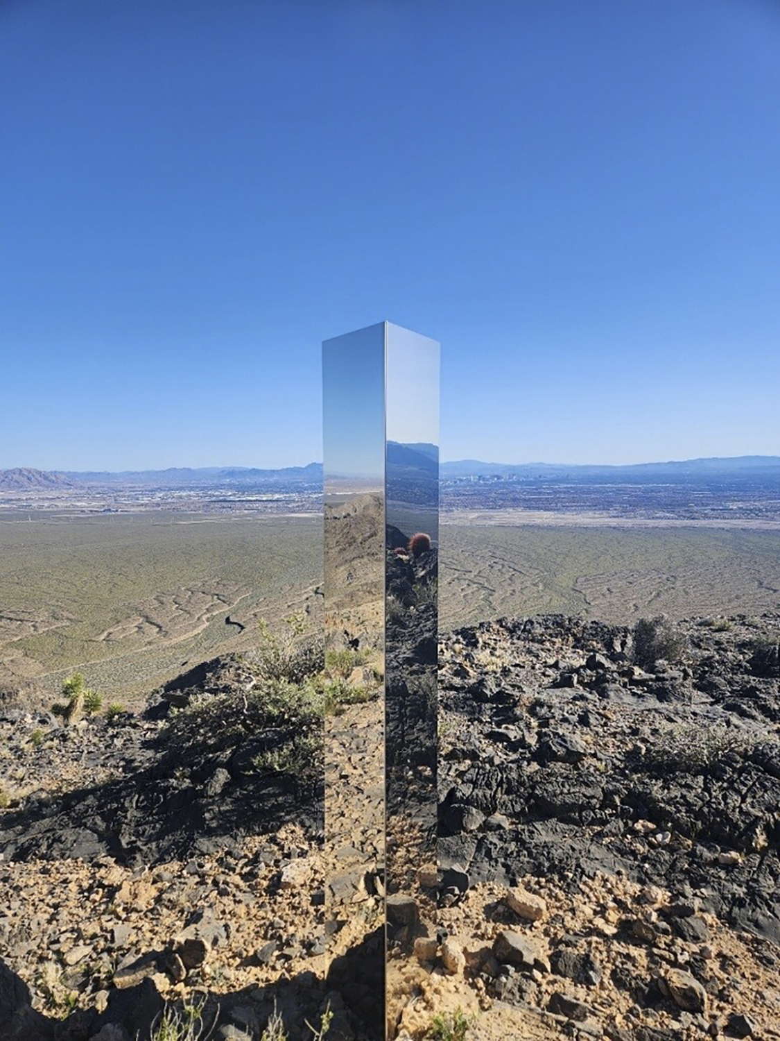 A monolith is seen near Gass Peak, Nev., on Sunday. The structure, jutting out of the rocks on a remote mountain peak near Las Vegas, has been removed.