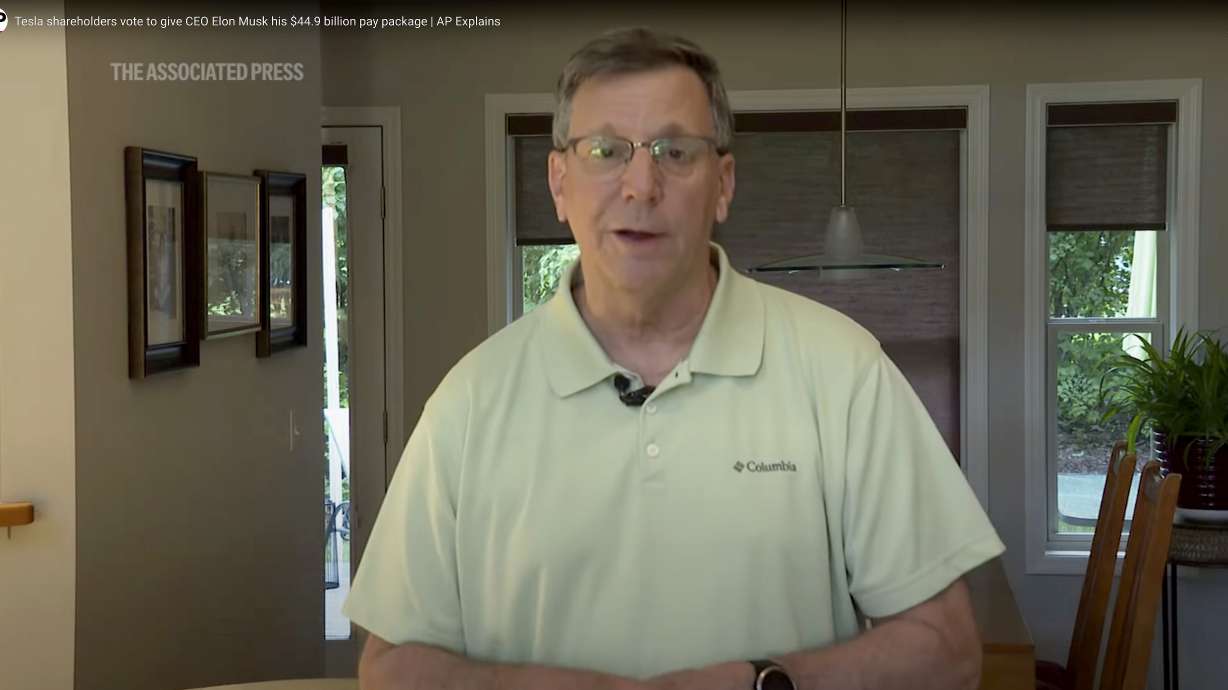 In this image taken from video, AP reporter Tom Krisher discusses a Tesla shareholder vote to restore CEO Elon Musk's $44.9 billion pay package, June 13, 2024. Manipulated video from the report circulated on the eve of the match between Slovakia and Ukraine at this year's European Championship, with the false claim that Slovak flags had been banned from all games because of their similarity to the Russian flag. No such video exists and the AP has not reported that there is a ban of Slovak flags at the soccer tournament.