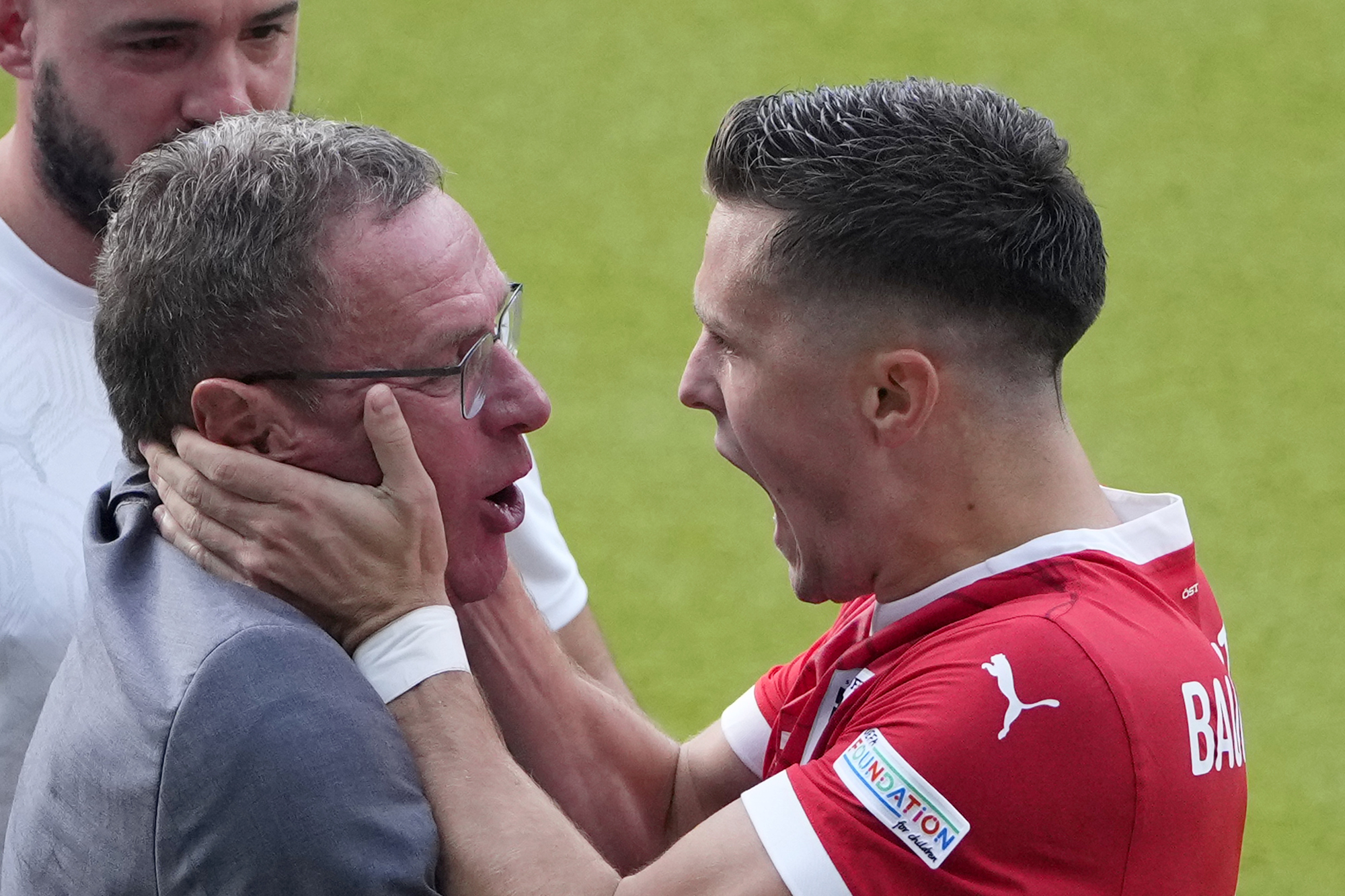 Austria's Christoph Baumgartner celebrates with Austria's head coach Ralf Rangnick after scoring his side's second goal during a Group D match between Poland and Austria at the Euro 2024 soccer tournament in Berlin, Germany, Friday, June 21, 2024. 