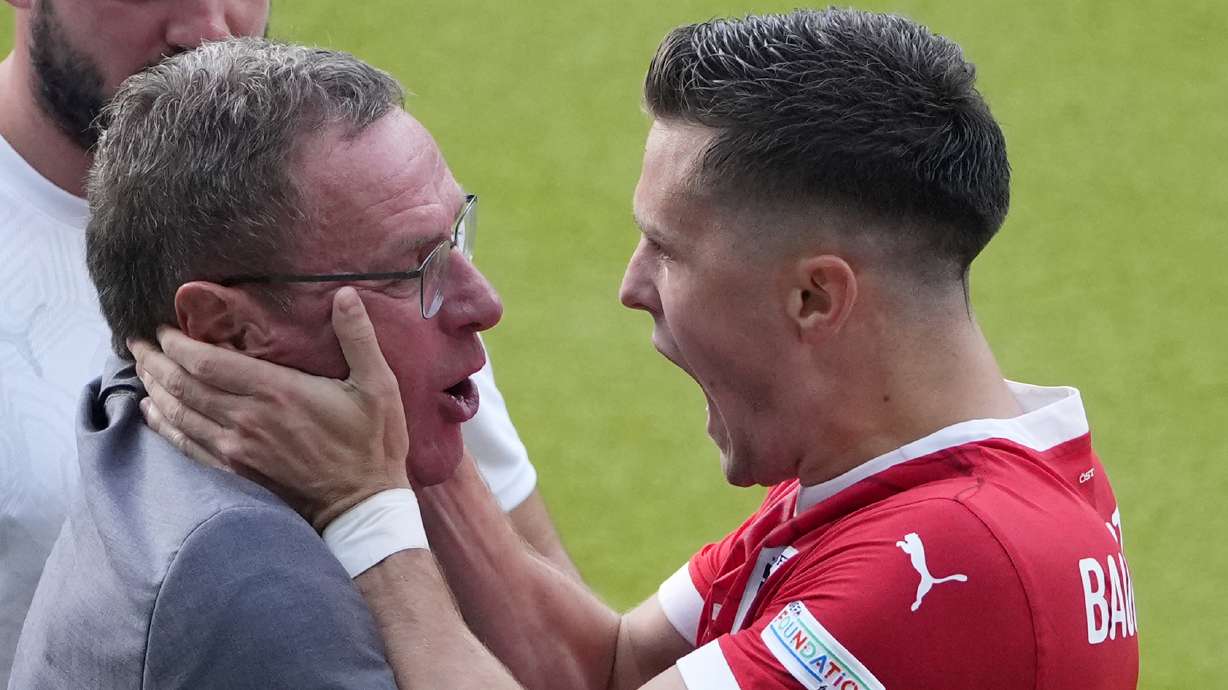 Austria's Christoph Baumgartner celebrates with Austria's head coach Ralf Rangnick after scoring his side's second goal during a Group D match between Poland and Austria at the Euro 2024 soccer tournament in Berlin, Germany, Friday, June 21, 2024.