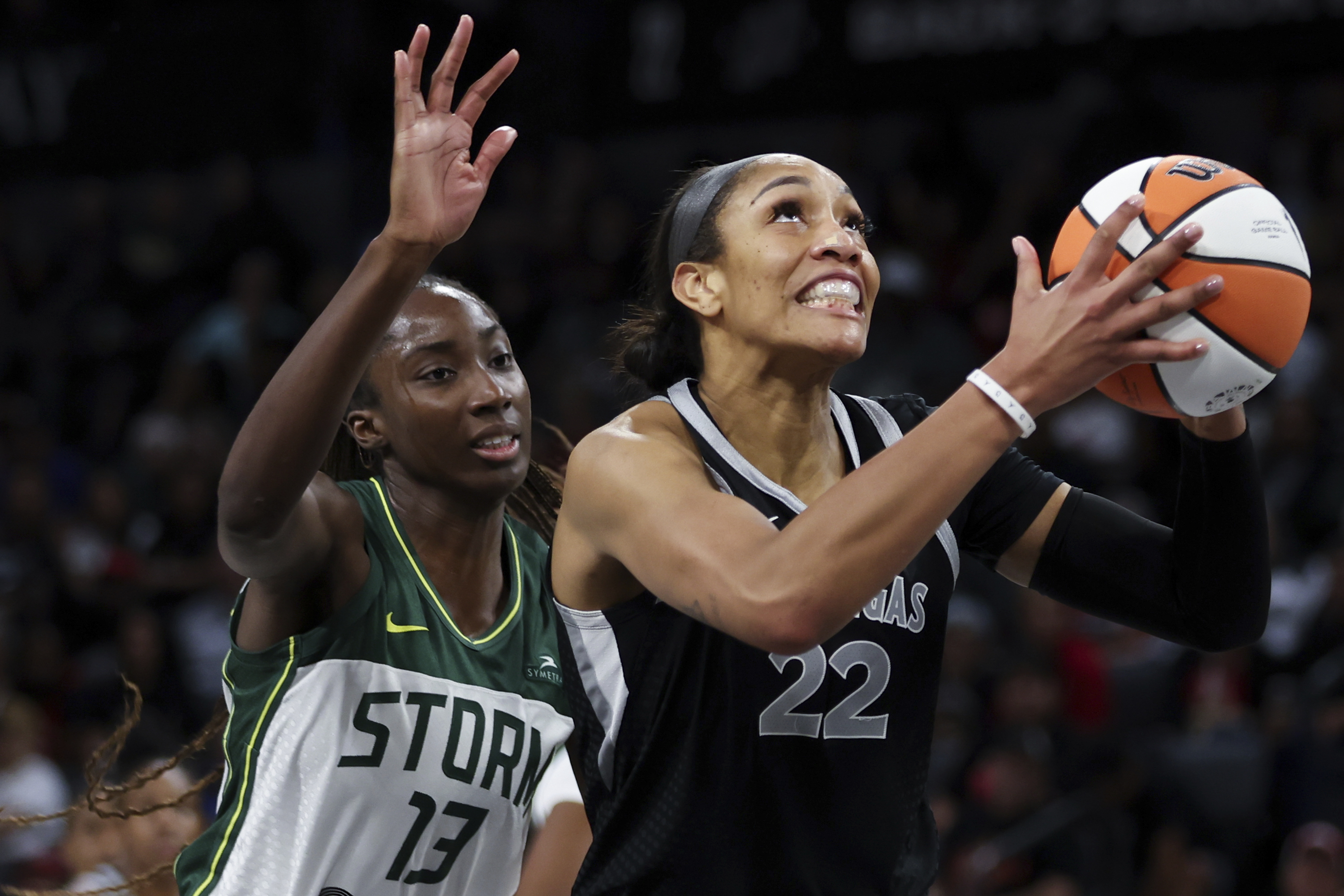 Las Vegas Aces center A'ja Wilson (22) shoots in front of Seattle Storm center Ezi Magbegor (13) during the second half of a WNBA basketball game Wednesday, June 19, 2024, in Las Vegas. 