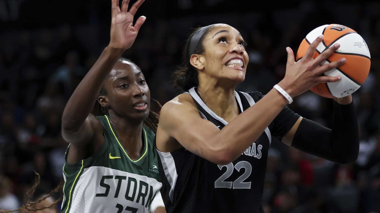 Las Vegas Aces center A'ja Wilson (22) shoots in front of Seattle Storm center Ezi Magbegor (13) during the second half of a WNBA basketball game Wednesday, June 19, 2024, in Las Vegas.
